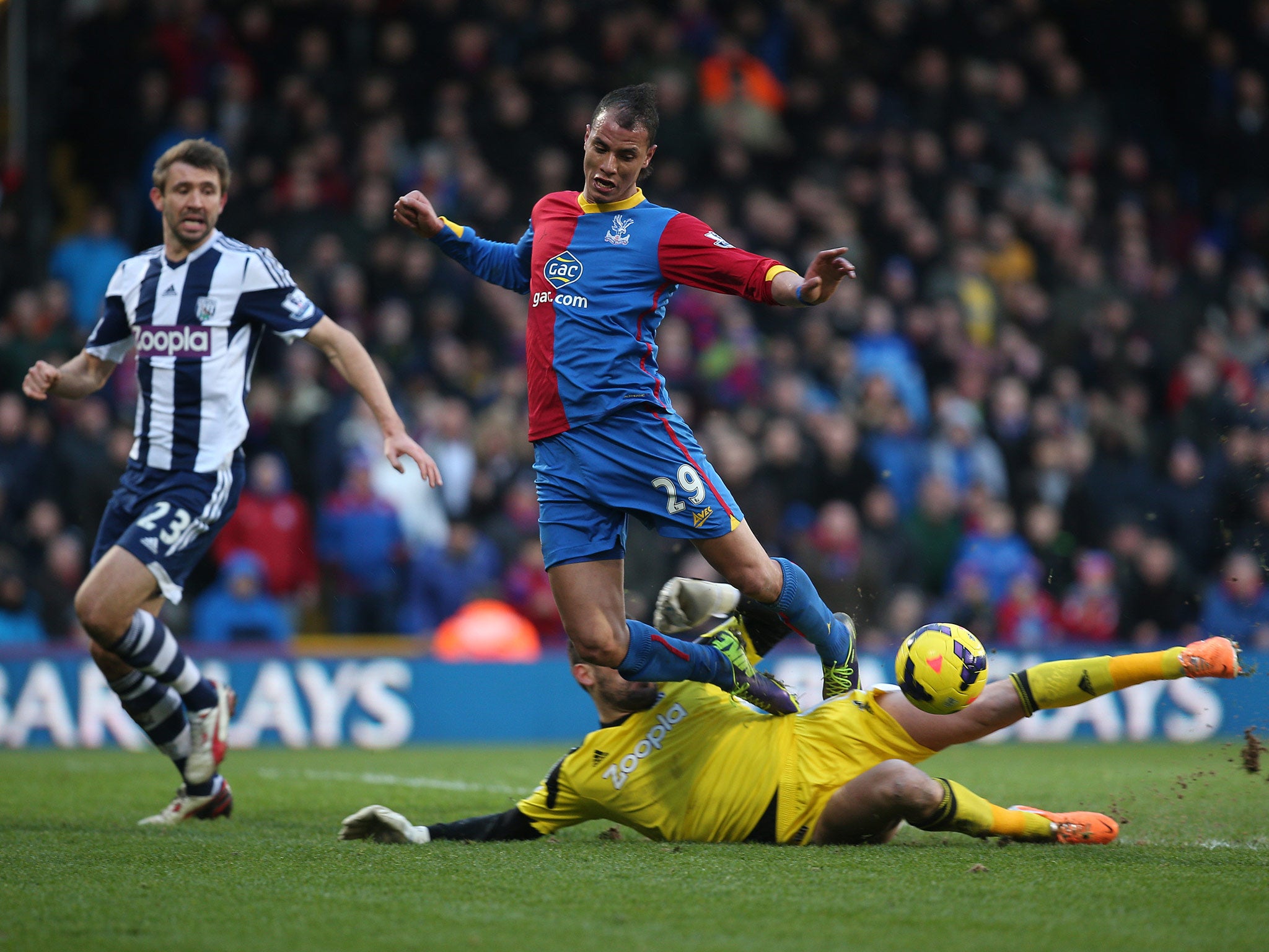 Marouane Chamakh of Palace is fouled by Ben Foster of West Brom