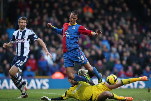 Marouane Chamakh of Palace is fouled by Ben Foster of West Brom 