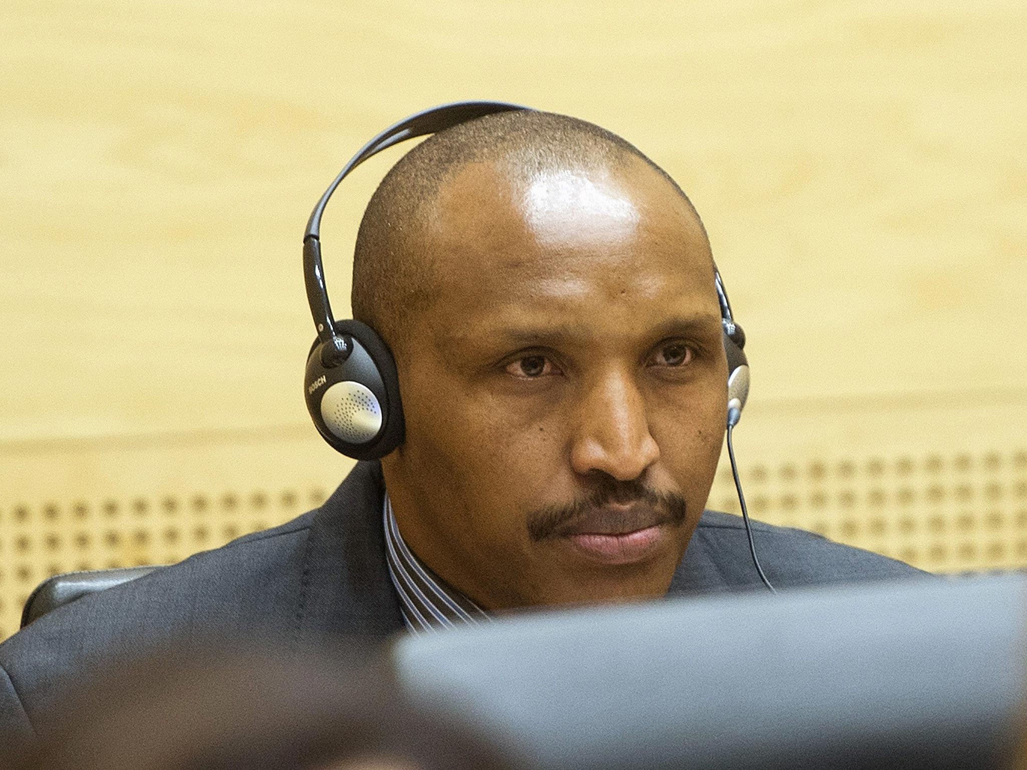 Congolese militia leader Bosco Ntaganda appears at the International Criminal Court charged with war crimes and crimes against humanity in a hearing in The Hague