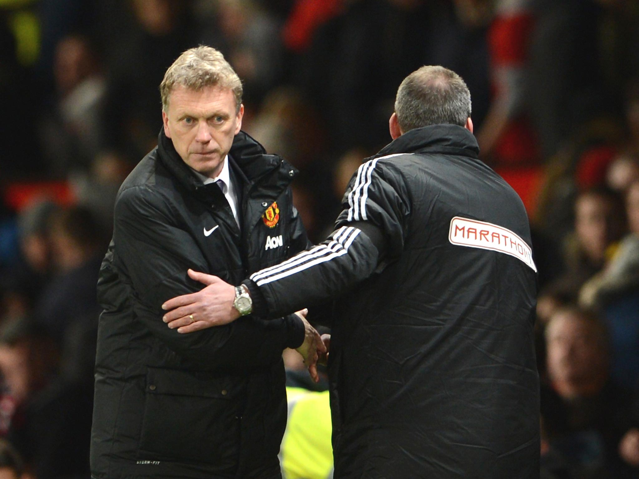 David Moyes (left) shakes hands with Fulham’s Rene Meulensteen
after Sunday’s 2-2 draw at Old Trafford