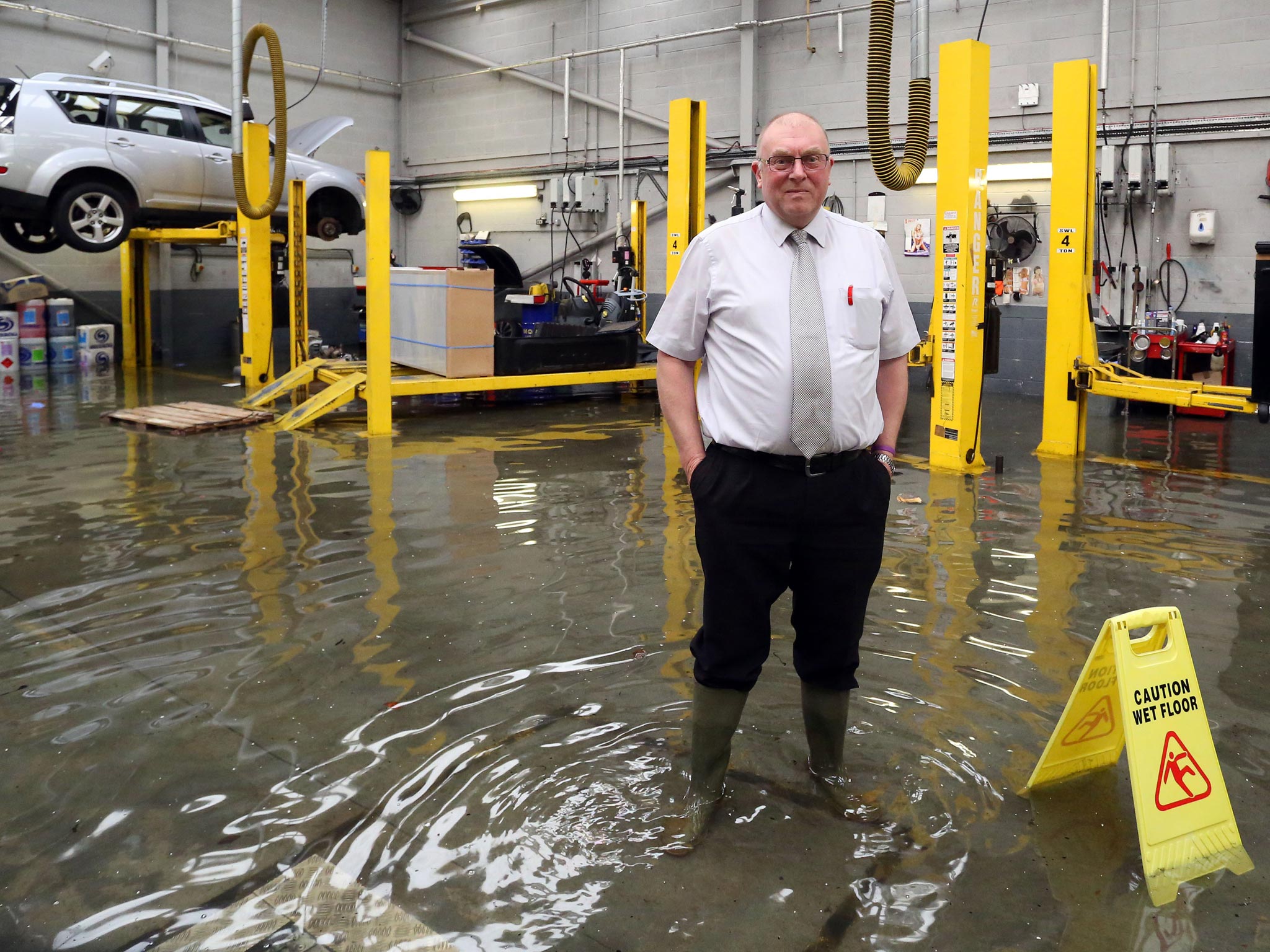 Mick Dummer in his car dealership at Chertsey