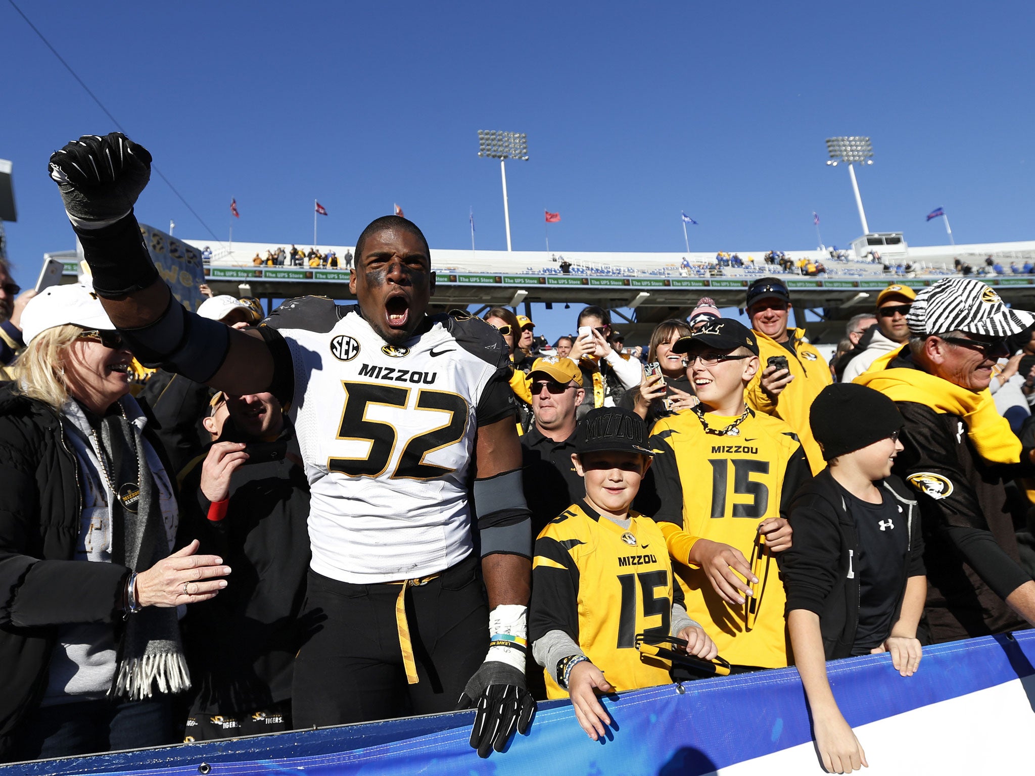 Michael Sam of the Missouri Tigers celebrates with fans after a game. He received support after he came out as gay on Sunday.