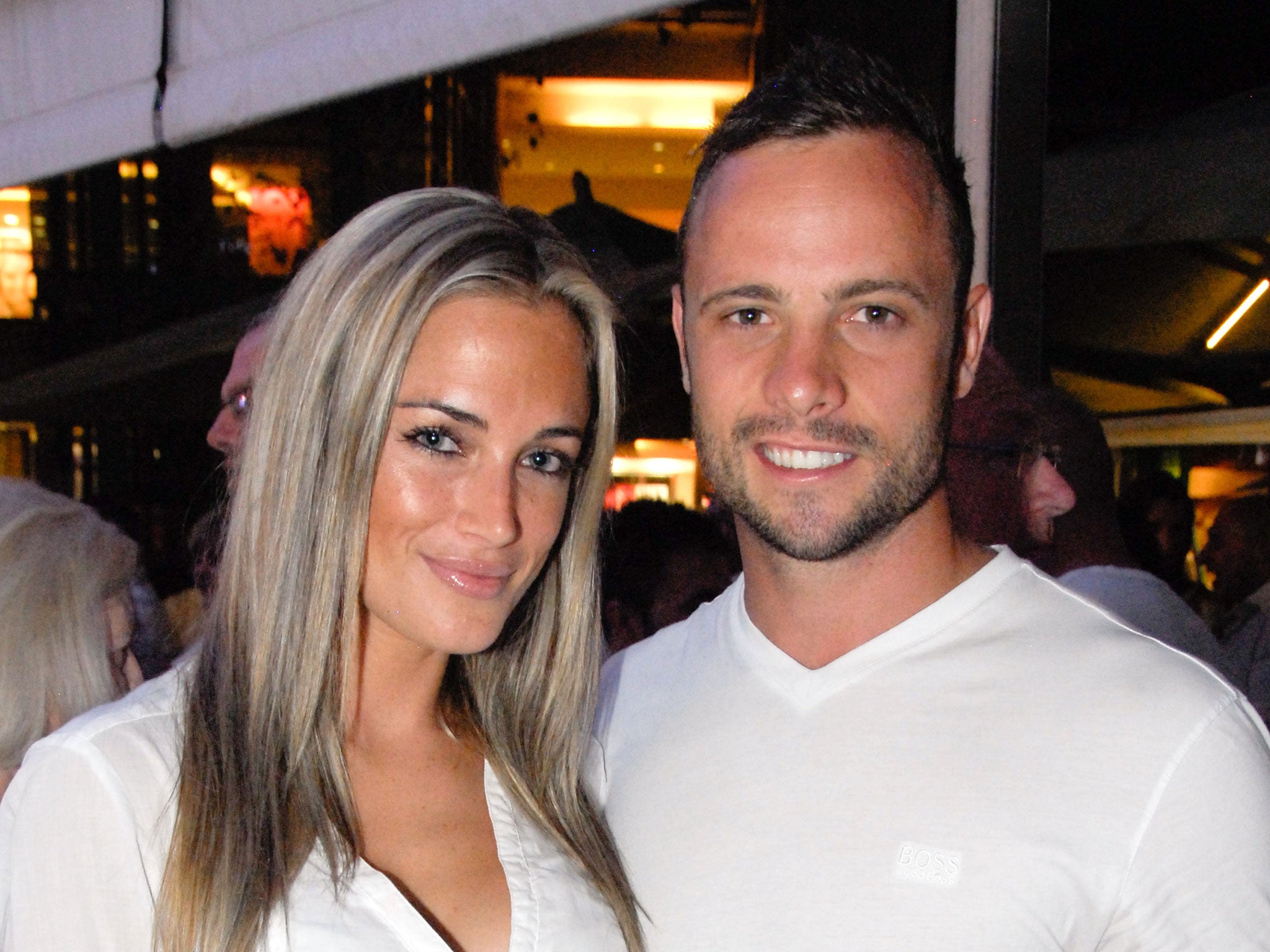 Oscar Pistorius posing next to his girlfriend Reeva Steenkamp at Melrose Arch in Johannesburg, 2013