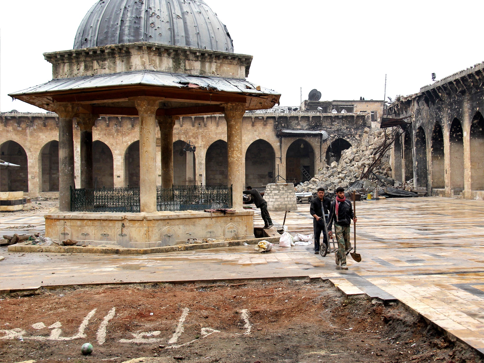 Aleppo’s Umayyad mosque: the rubble is all that remains of its minaret, which was blown up during fighting last year (Getty)