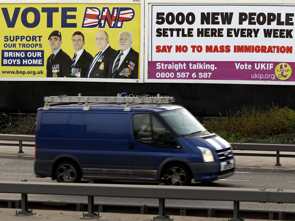 A van drives past posters encouraging voters to support the British National Party (BNP) and the UK Independence Party (UKIP) in Newham on April 10, 2010 in London, England. BNP leader Nick Griffin is attempting to unseat the Labour MP Margaret Hodge in t