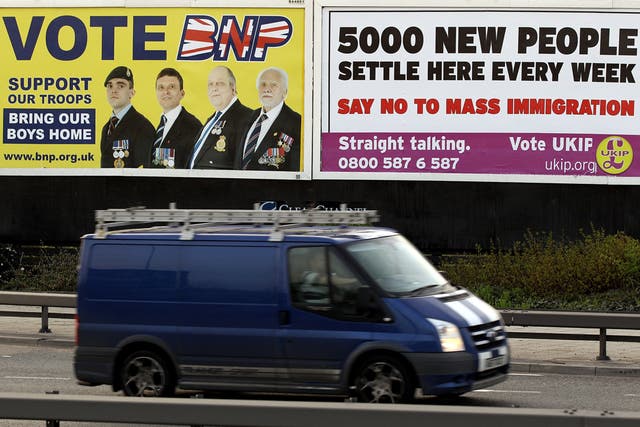 A van drives past posters encouraging voters to support the British National Party (BNP) and the UK Independence Party (UKIP) in Newham on April 10, 2010 in London, England. BNP leader Nick Griffin is attempting to unseat the Labour MP Margaret Hodge in t