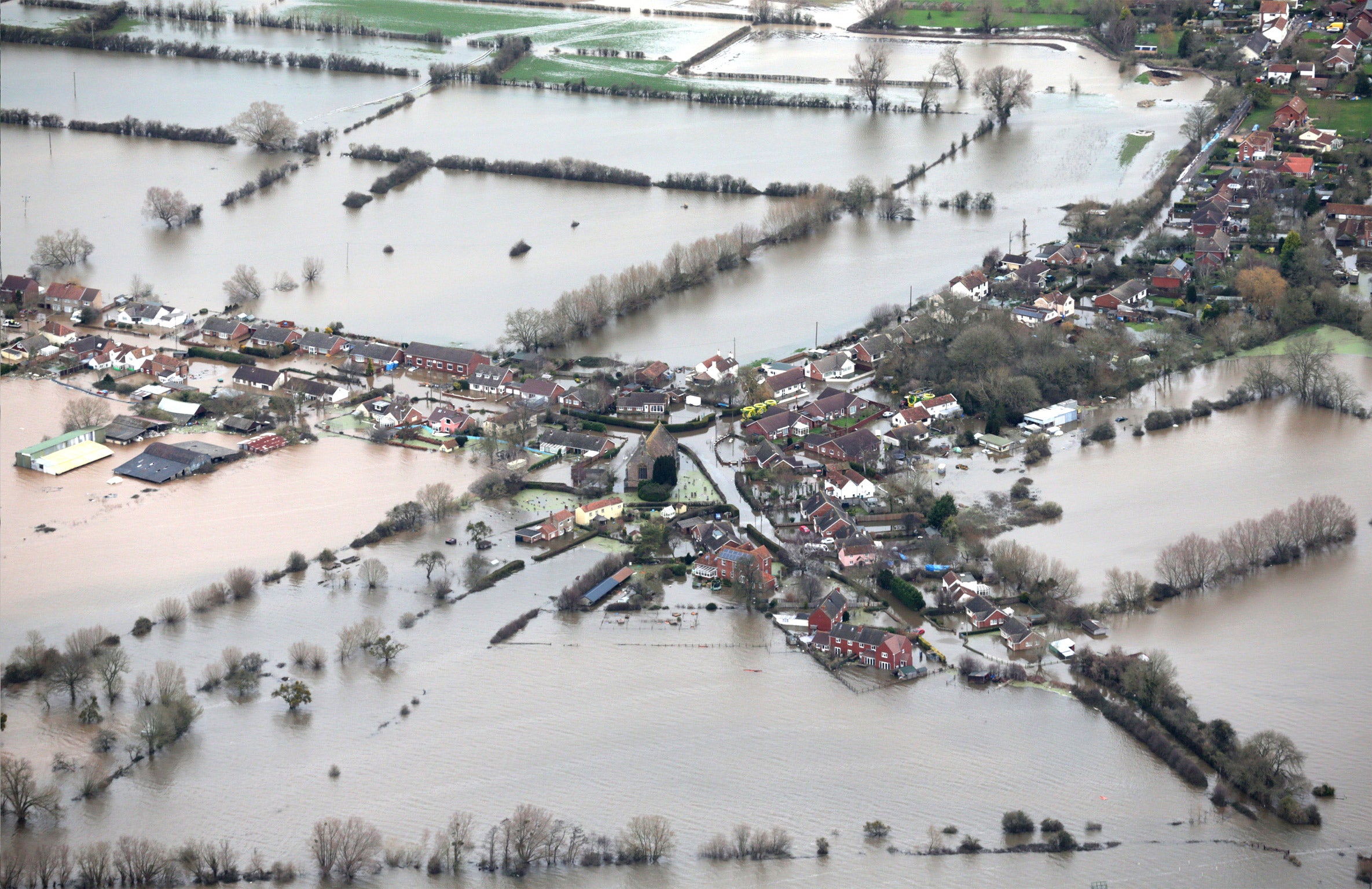 Water surrounds flooded propeties in the village of Moorland on the Somerset Levels near Bridgwater (Getty)