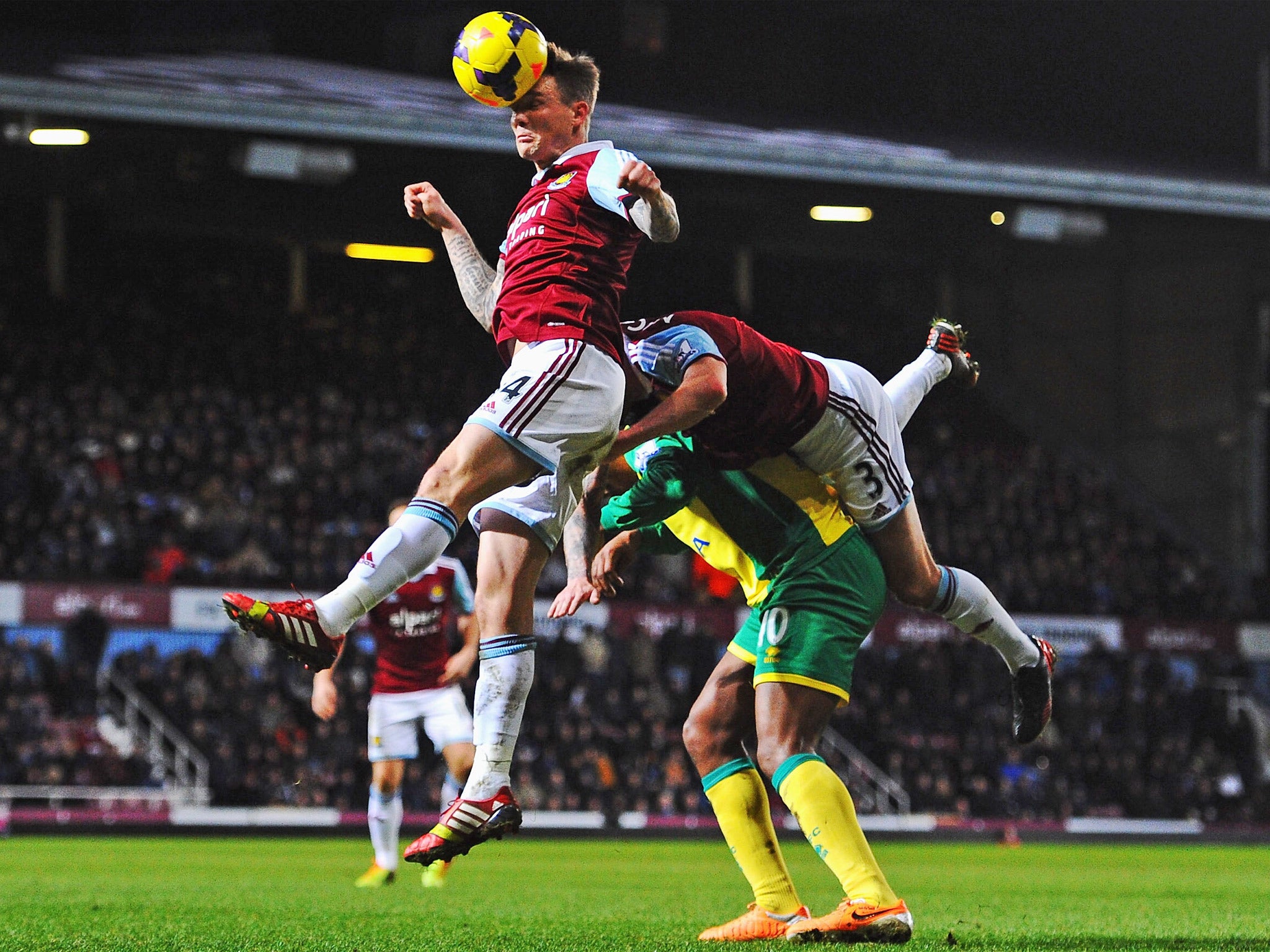 Leroy Fer (centre) and George McCartney collide into Matthew Taylor as he heads the ball (Getty)