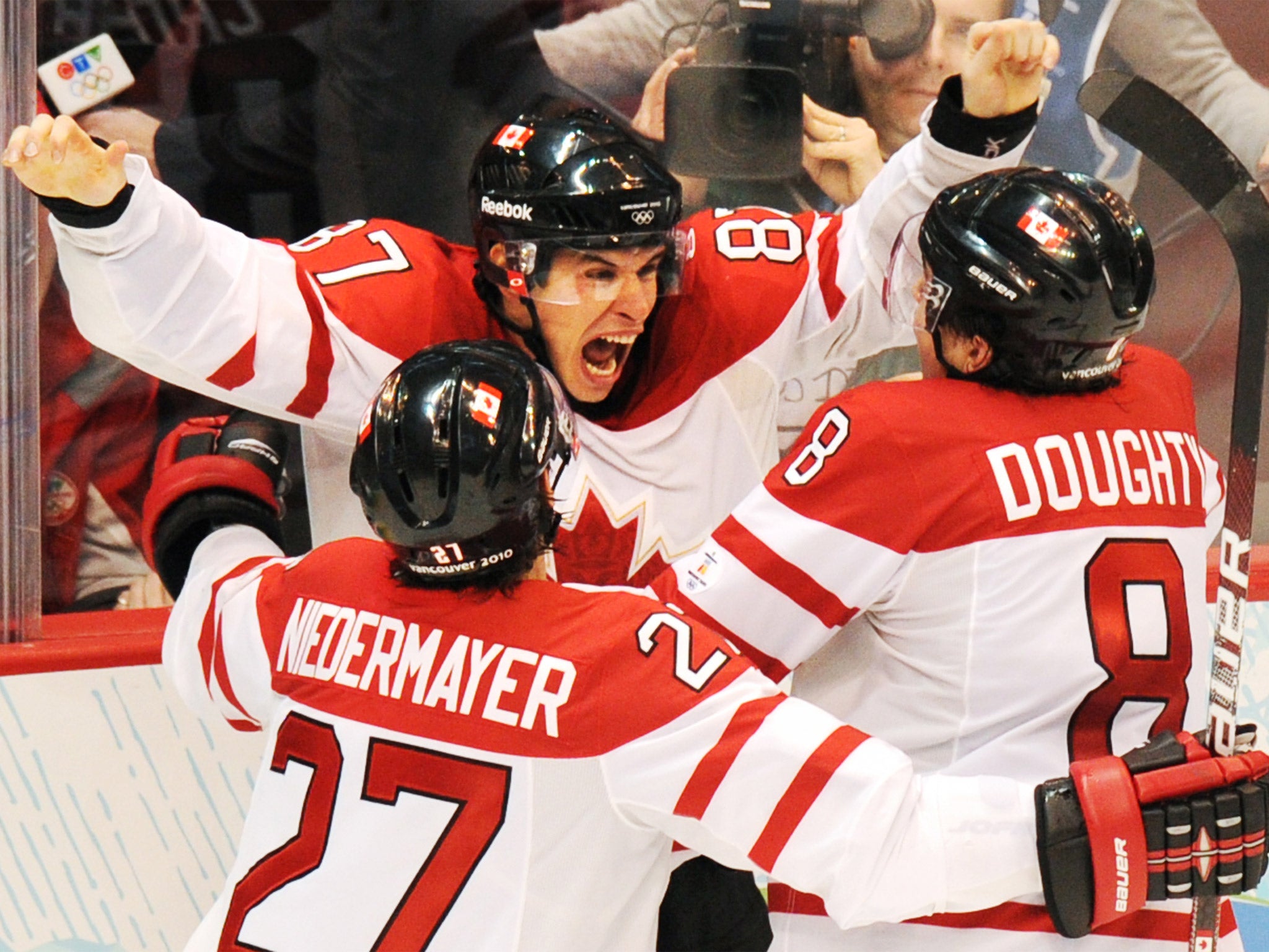 Sidney Crosby (centre) celebrates scoring the winner against the US at the 2010 Vancouver Games (Getty)