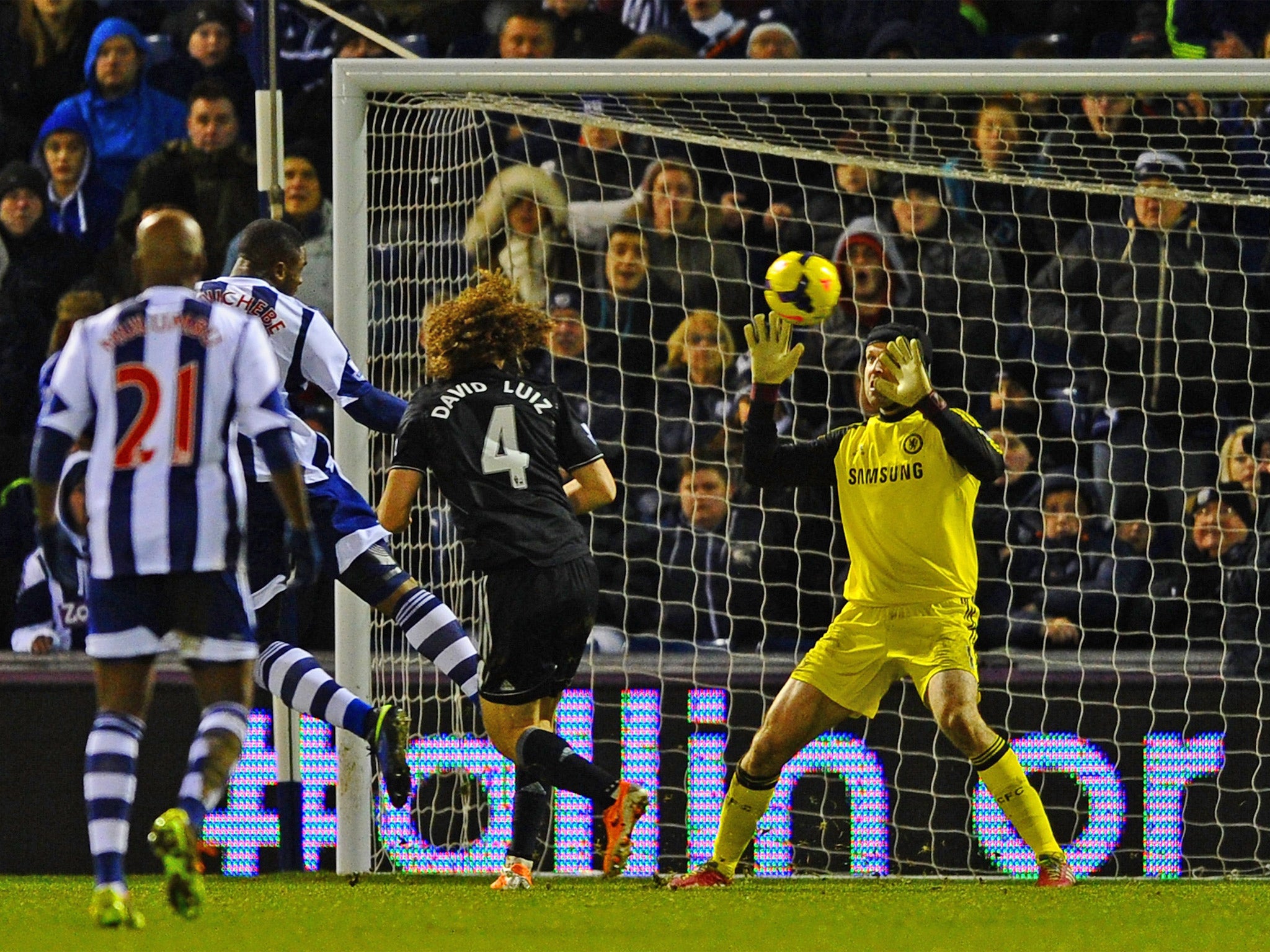 West Brom's Victor Anichebe heads past Petr Cech to deny Chelsea the three points
