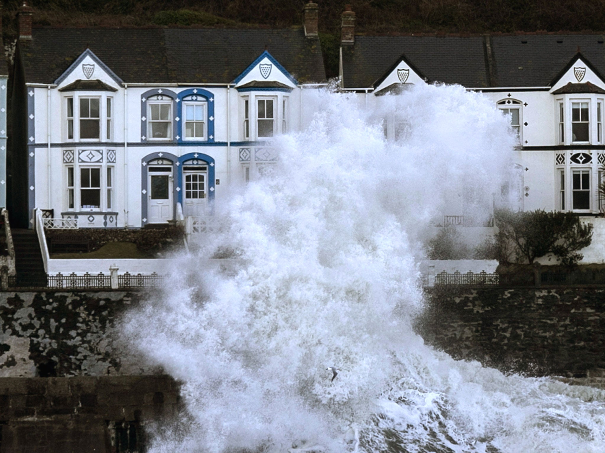 Storm waves break at Porthleven in Cornwall. Meanwhile, in Wiltshire a man was pronounced dead at the scene after he reportedly tried to move a tree