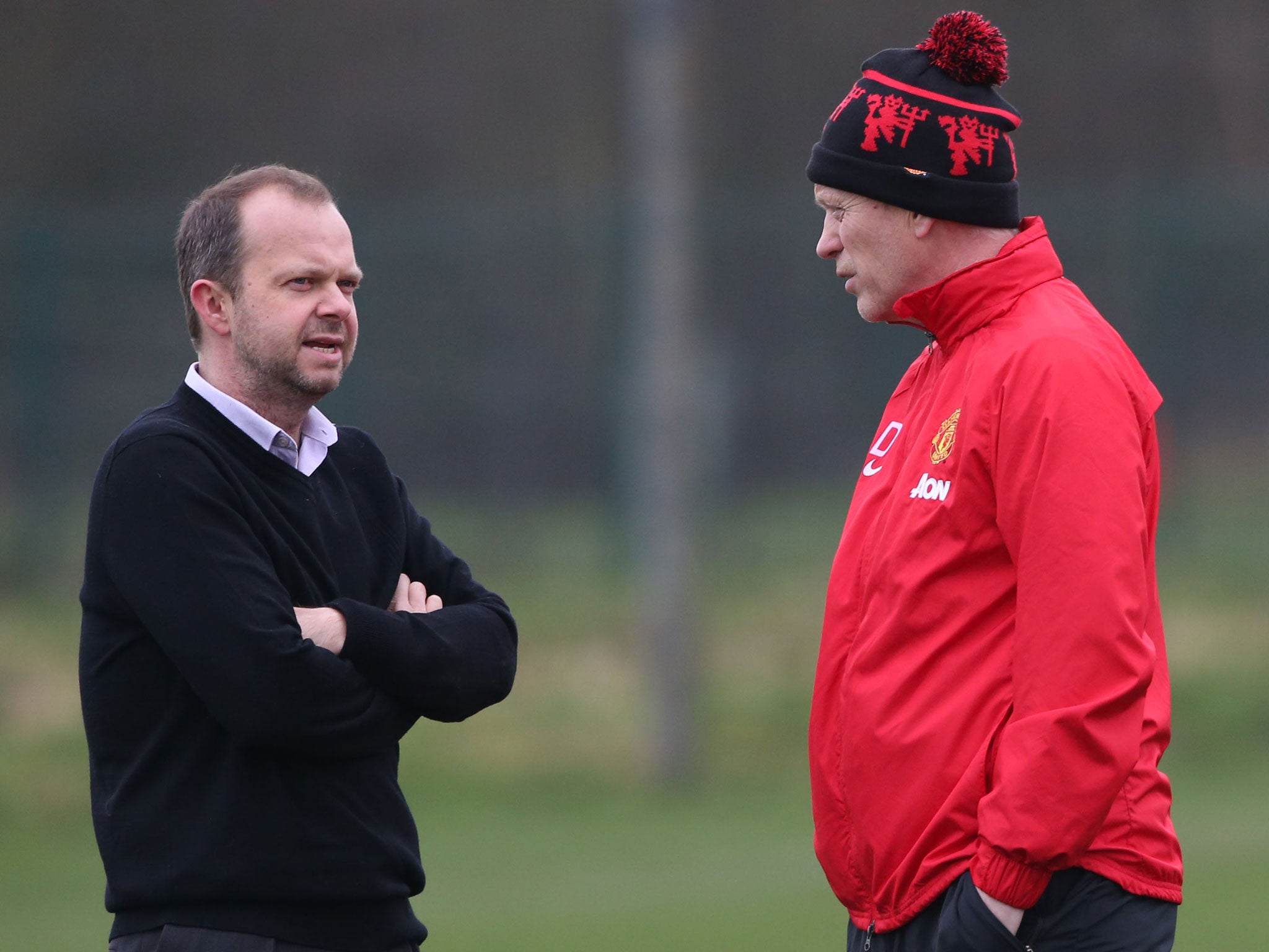 Manchester United executive vice-chairman Ed Woodward speaks with manager David Moyes