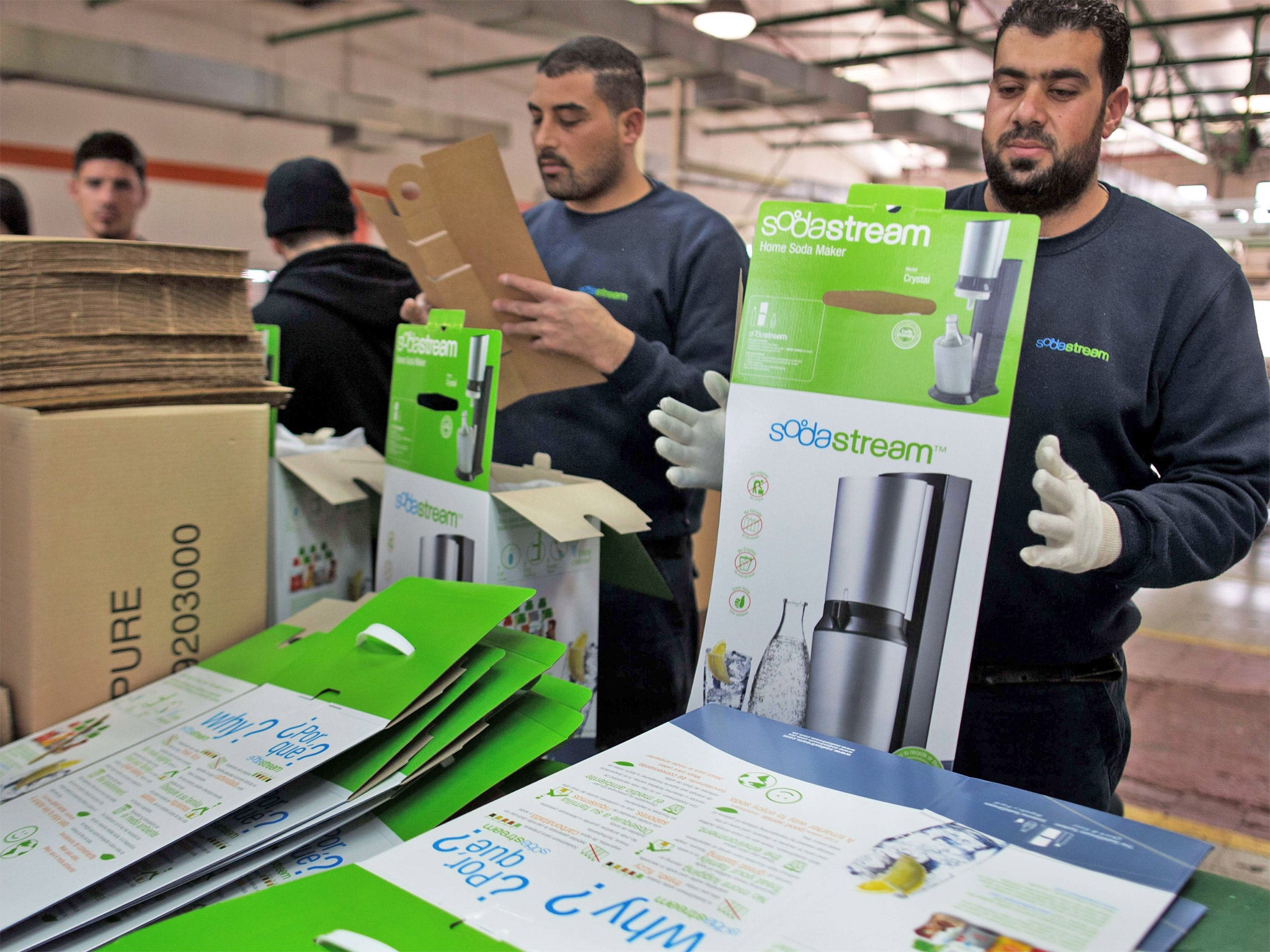 Workers at the SodaStream factory next to the West Bank settlement of Maale Adumim (Getty)