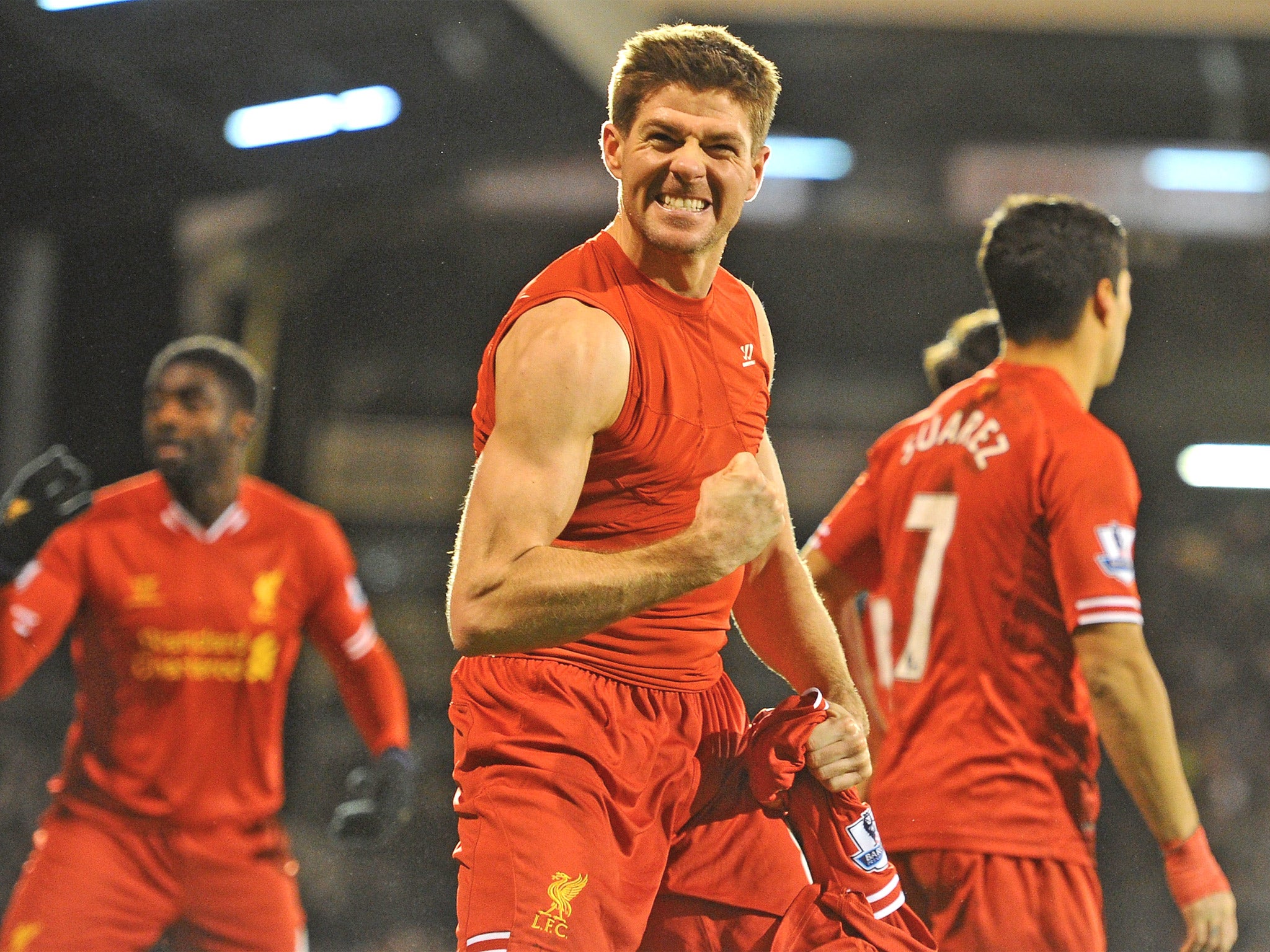 Steven Gerrard shows off his guns after Liverpool came from behind to beat Fulham