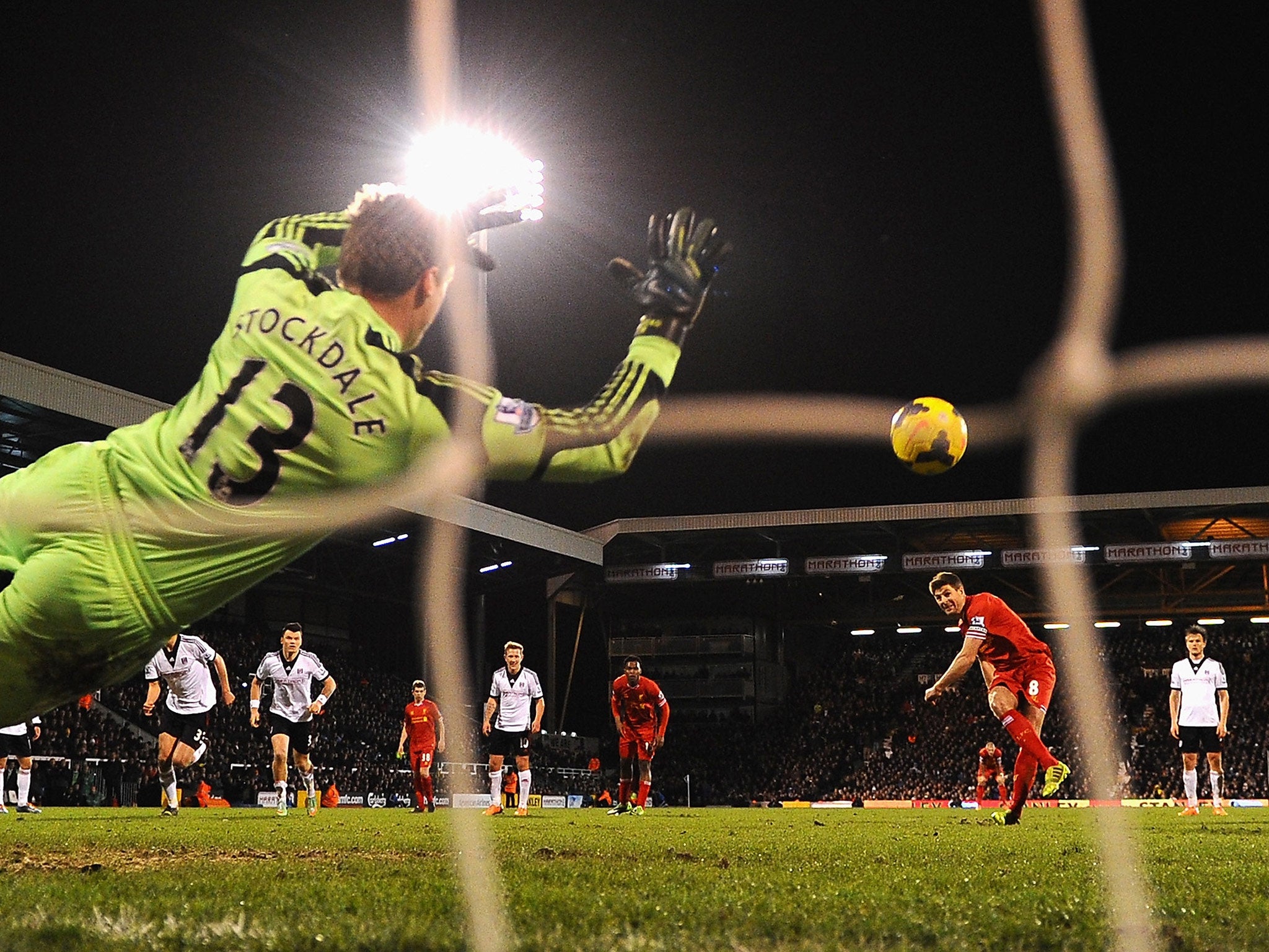 Steven Gerrard buries an injury time penalty for Liverpool against Fulham