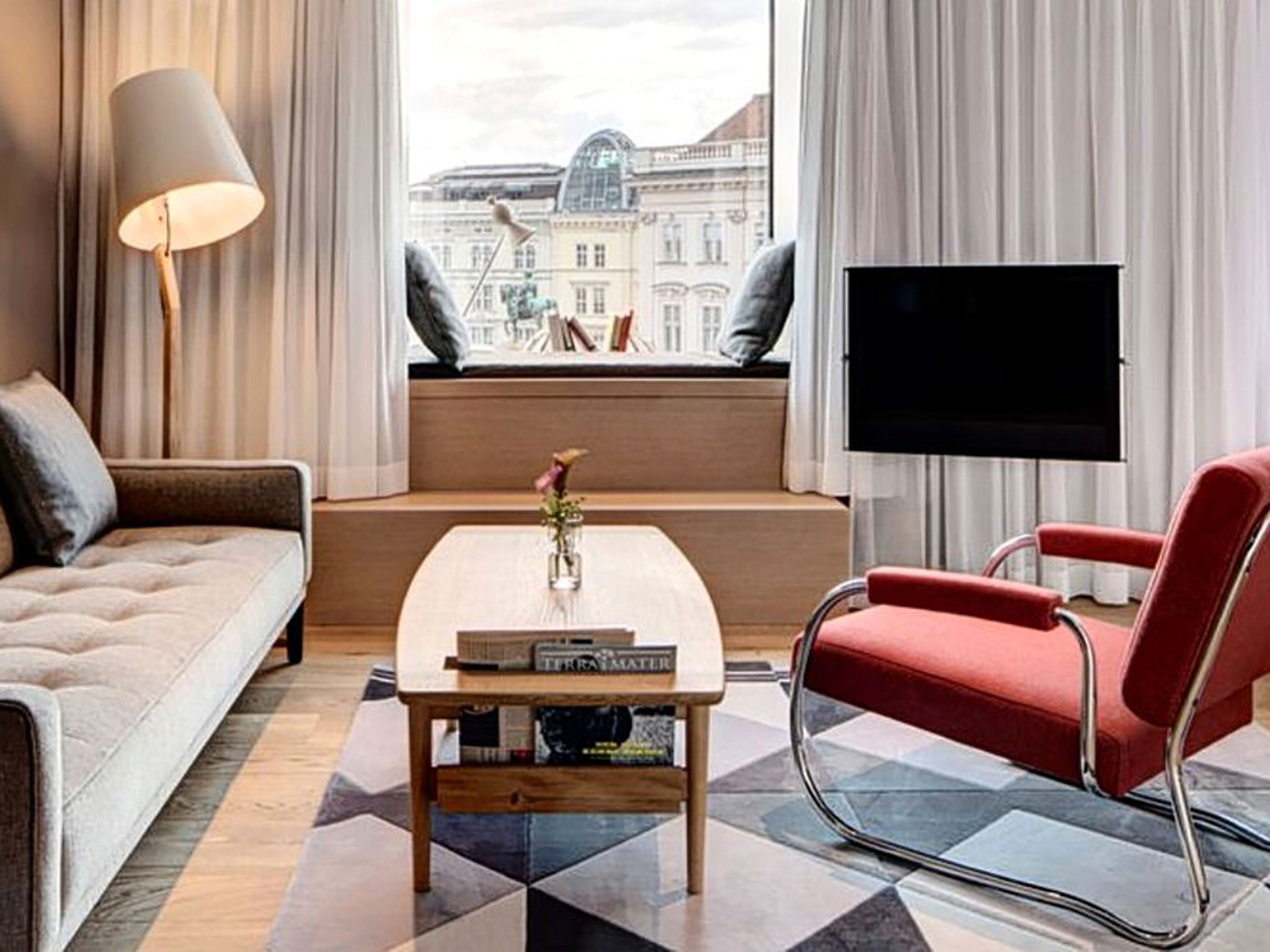 The Guesthouse is a new boutique hotel in Vienna with sleek, modern rooms, mid-century furniture and window seats that gaze across the city's rooftops.