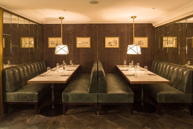 Clubbishly attractive: The restaurant's small, dark dining room has been de-blinged