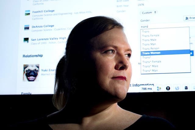 Facebook software engineer Brielle Harrison demonstrates Facebook's expanded options for gender identification at her company's headquarters.  Harrison plans to switch her identifier to "Trans Woman." 