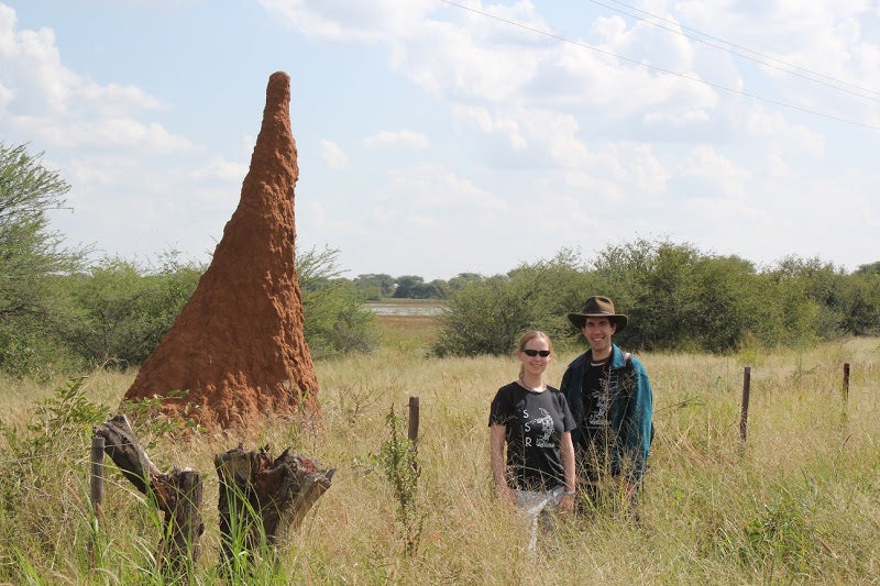 Harvard graduate student Kirstin Petersen and staff scientist Justin Werfel with a termite mound in Namibia. (Self-Organizing Systems Research Group, Harvard SEAS)