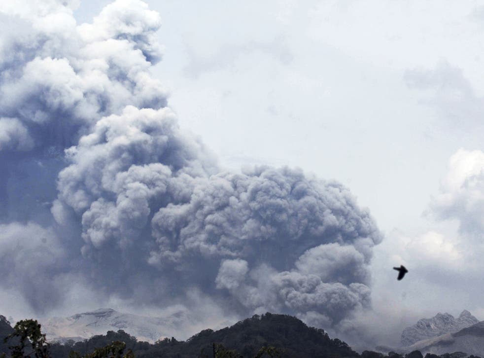 Mount Kelud erupts, as seen from Anyar village in Blitar, East Java, Indonesia, Friday, 14 Feb 2014. 