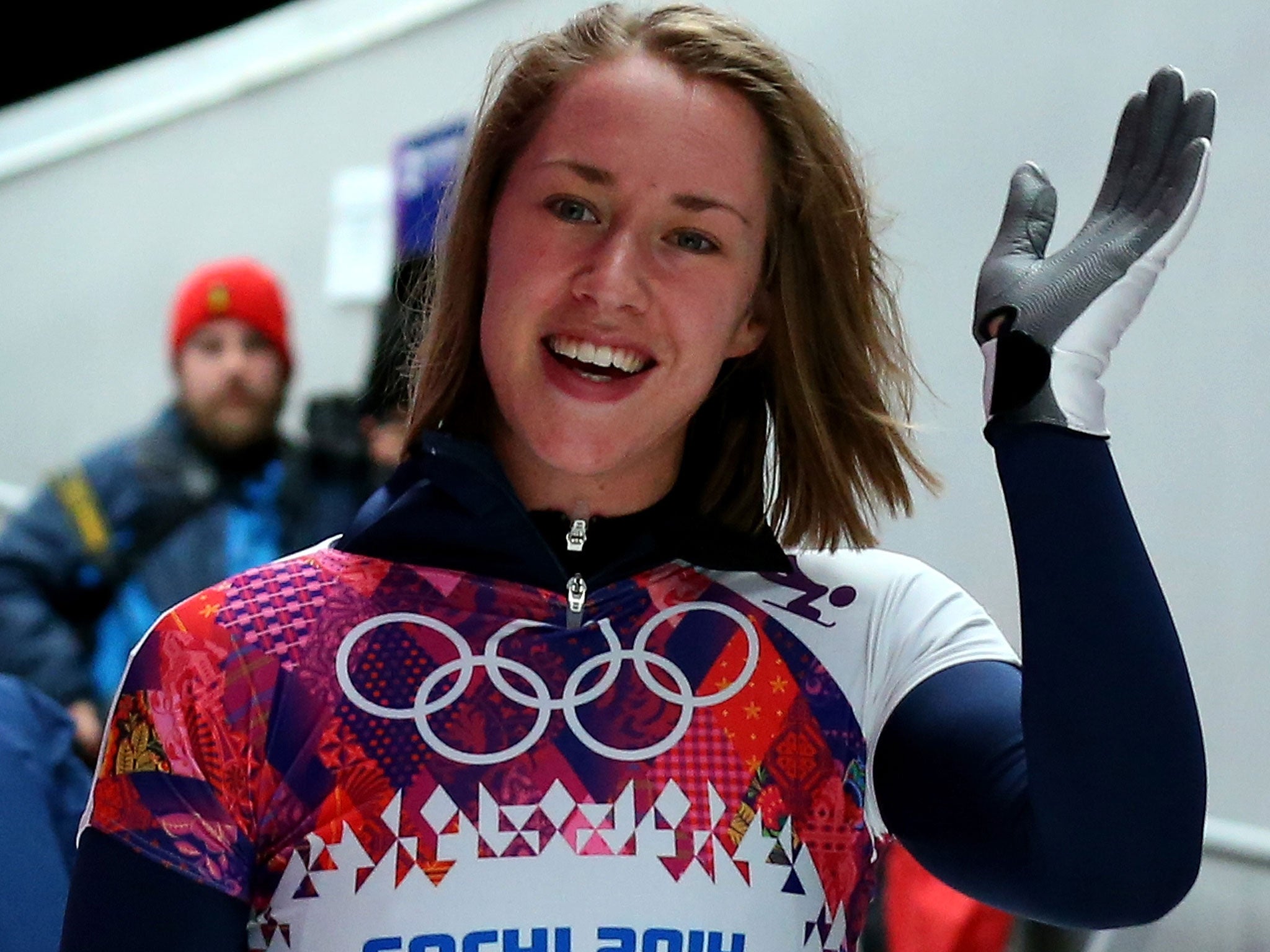 Lizzy Yarnold of Great Britain waves to fans after competing her third run during the Women's Skeleton today