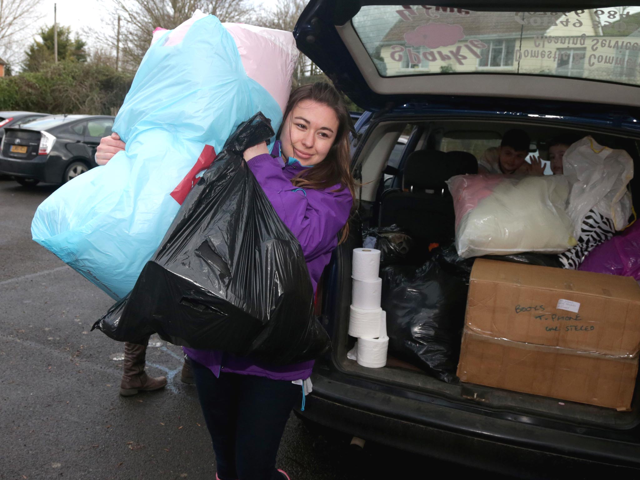 Volunteers sort out donations in the King Alfred Inn at Burrowbridge on the Somerset Levels