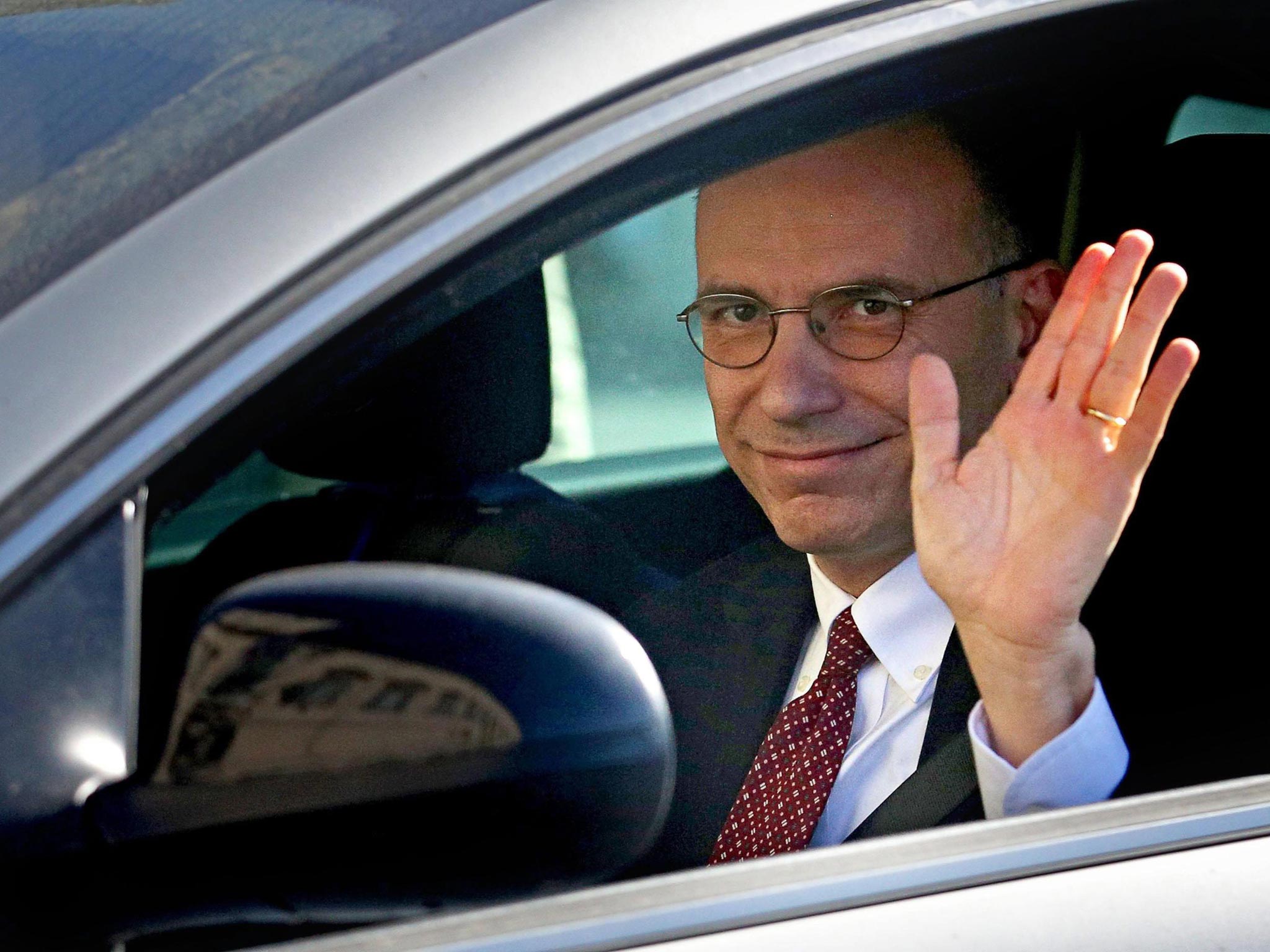 Italian Premier Enrico Letta arrives at the Quirinal Palace to tender his resignation