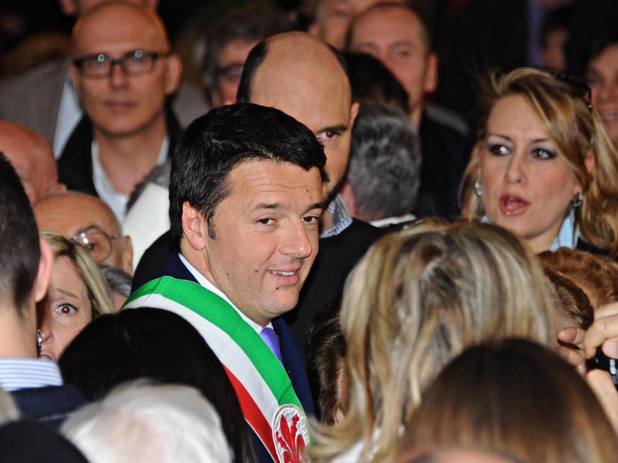 Democratic Party (PD) leader and Florence Mayor, Matteo Renzi (centre) smiles during a ceremony at the Palazzo Vecchio in Florence