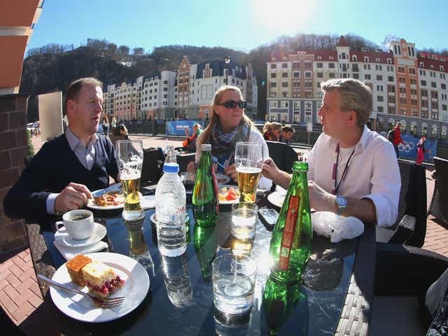 Visitors enjoy the sun at Rosa Khutor village near the mountain cluster