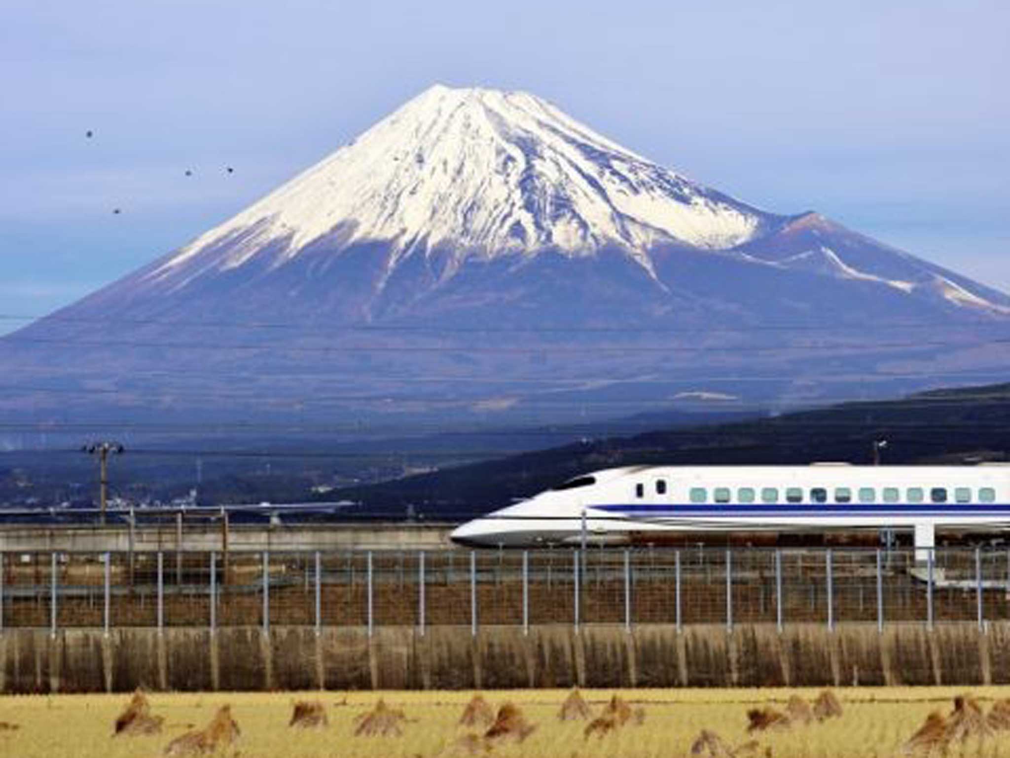 Bullet point: A Shinkansen train speeds past Japan’s premier icon, Mount Fuji