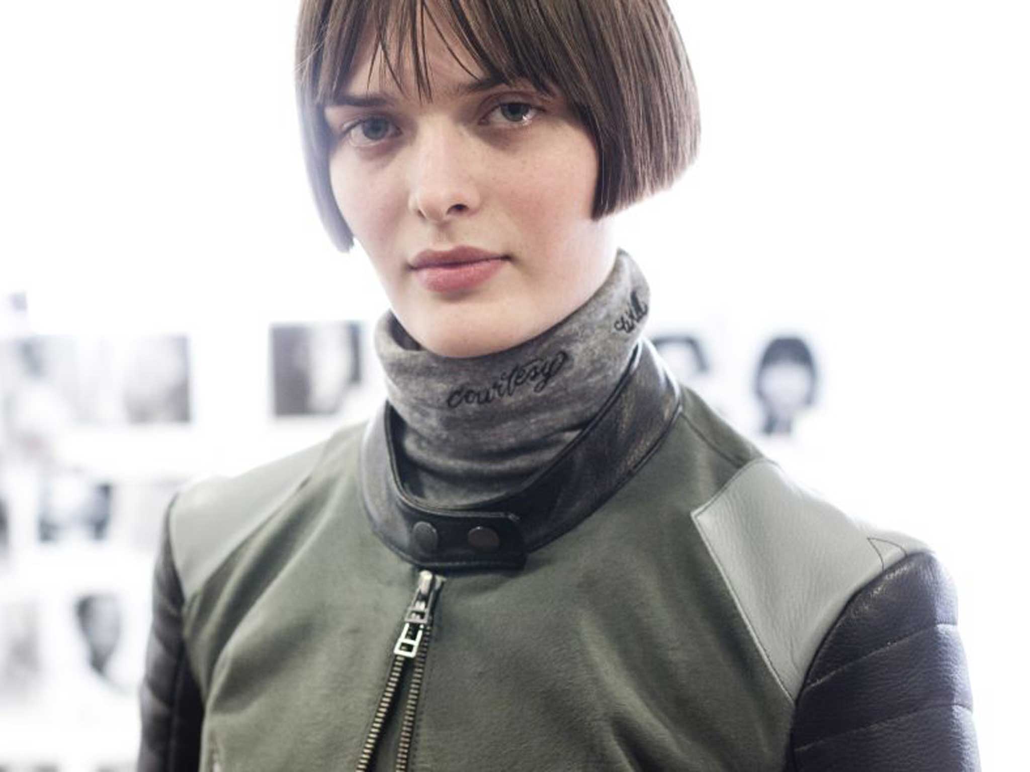 Preparing for Topshop Unique’s catwalk show, with model Sam Rollinson