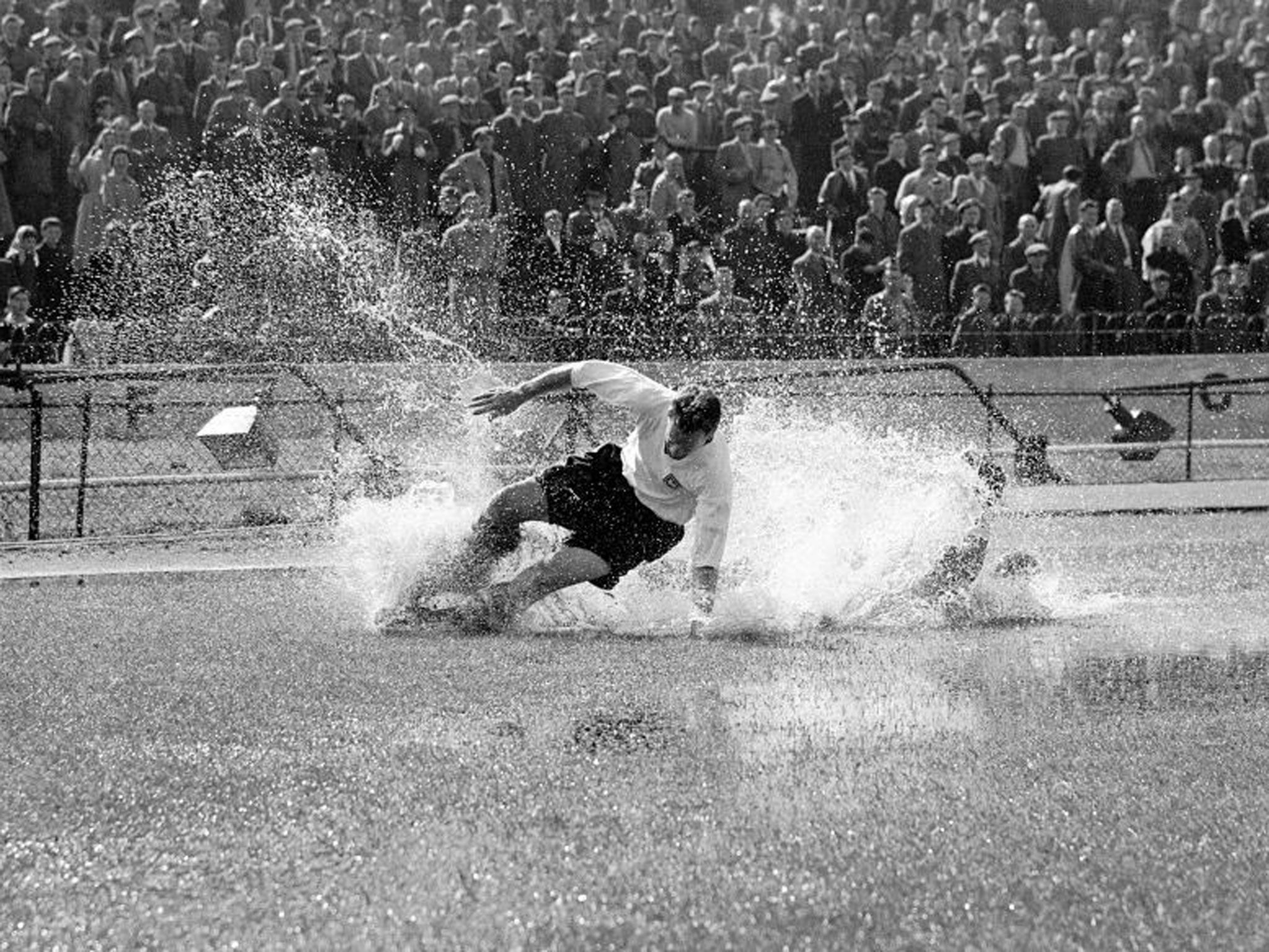 Making a splash: An iconic photo of the great man and the conditions he sometimes had to endure