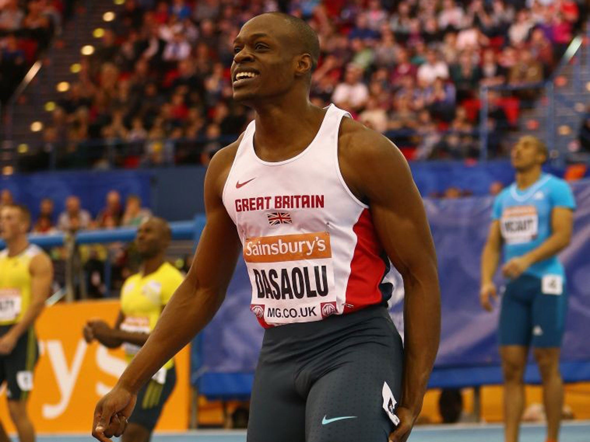 Hollow victory: James Dasaolu feels the strain after his 60m triumph