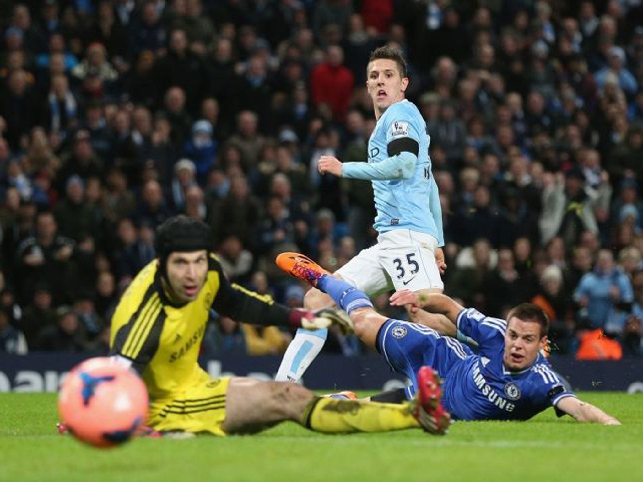 Watchmen: Stevan Jovetic looks on as he scores Manchester City’s opening goal past Chelsea’s Petr Cech (left) and Nemanja Matic (right) during yesterday’s FA Cup tie