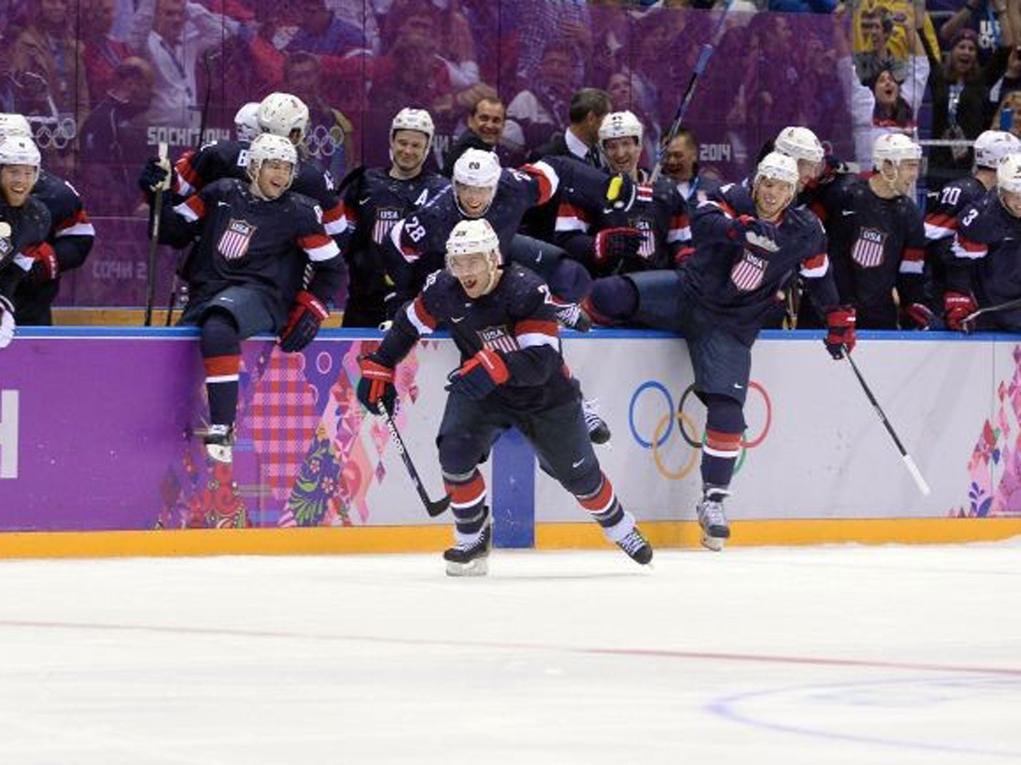 Ice one: TJ Oshie hits the winner, then is joined by his team-mates