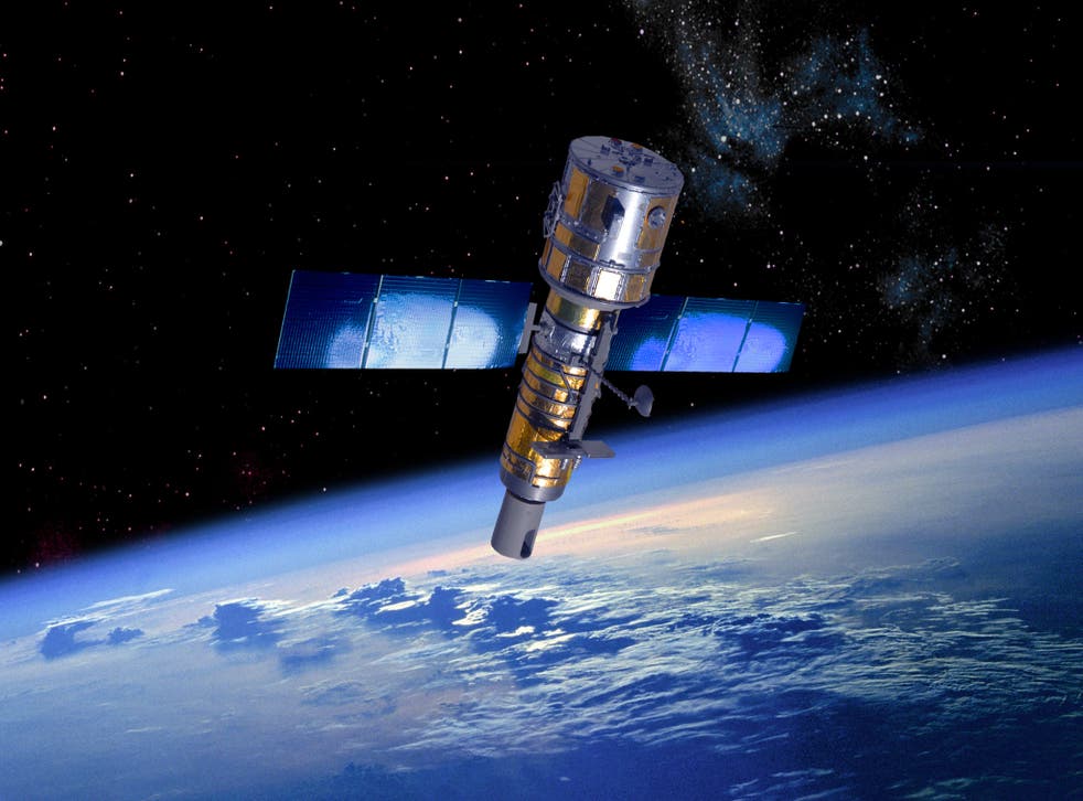 An artist's rendition of a military reconnaissance satellite in orbit above the Earth