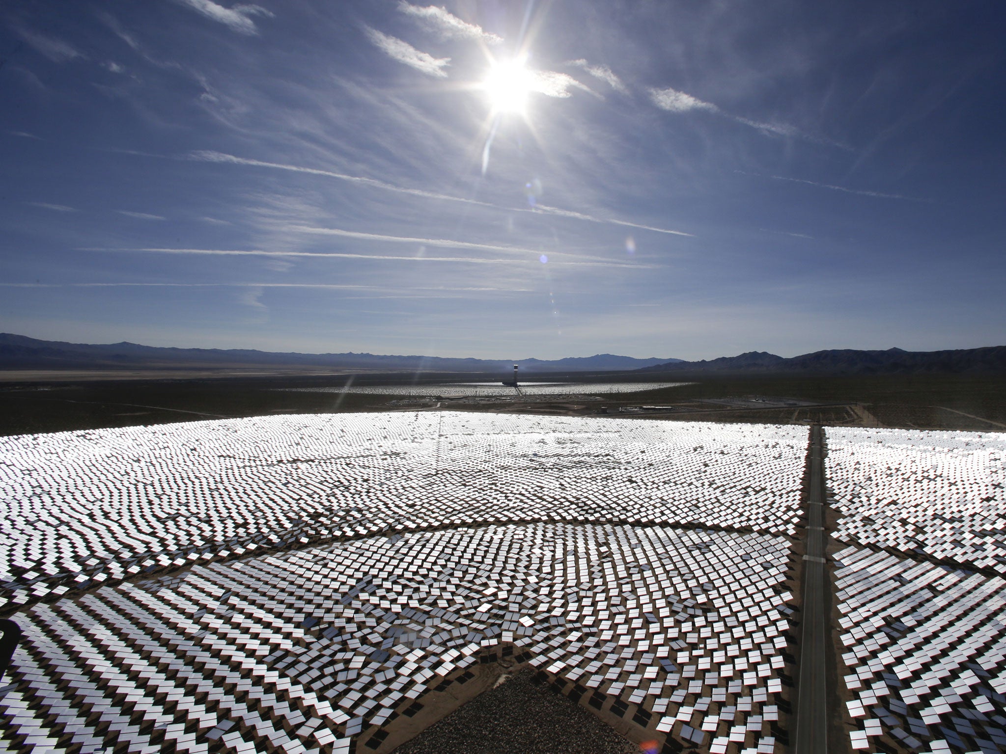Some of Ivanpah's 300,000 computer-controlled mirrors, each about 7 feet high and 10 feet wide, reflect sunlight to boilers that sit on 459-foot towers