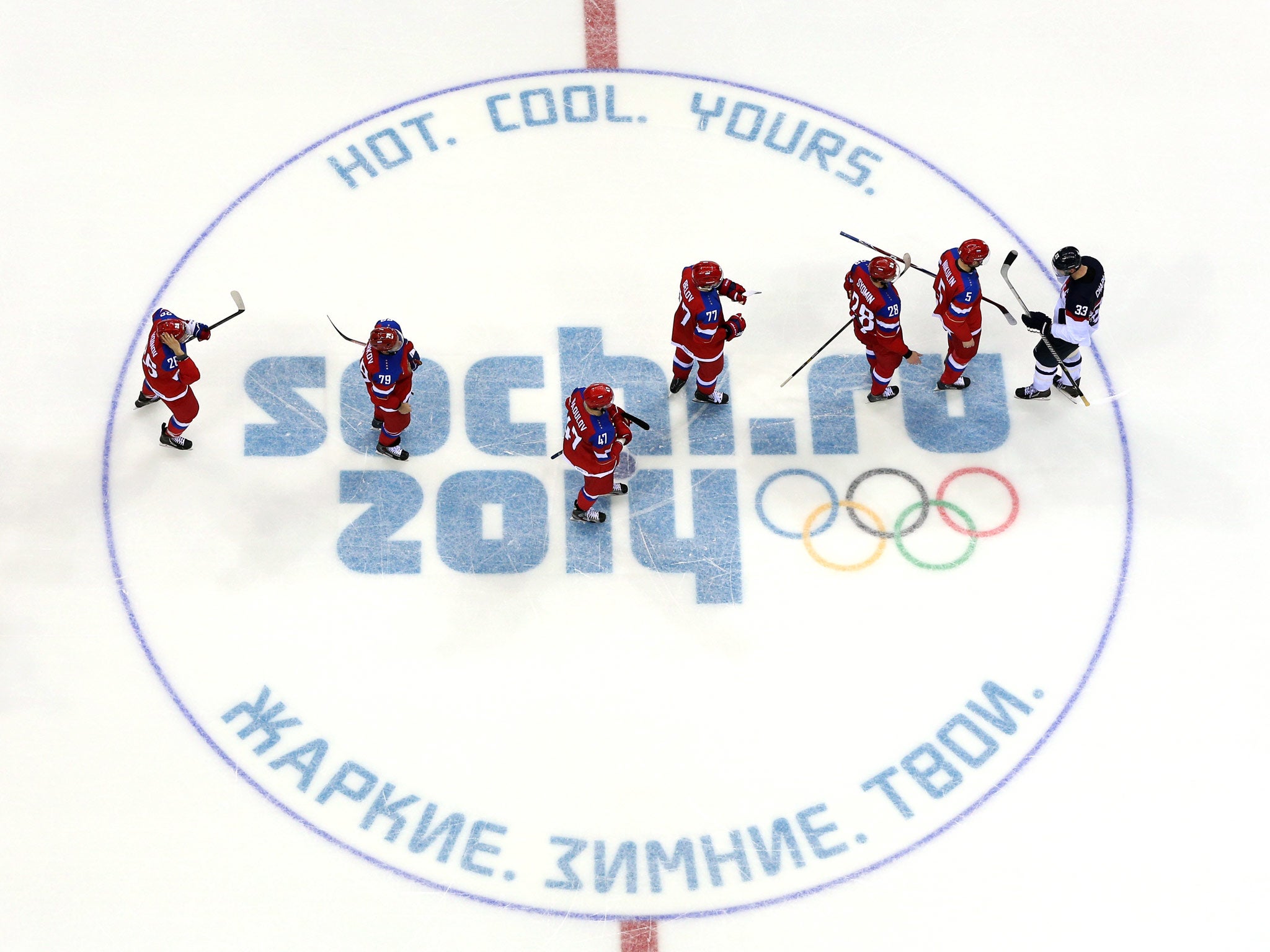 Ilya Nikulin #5 of Russia talks with Zdeno Chara #33 of Slovakia after defeating Slovakia in a shoot out during the Men's Ice Hockey Preliminary Round Group A game
