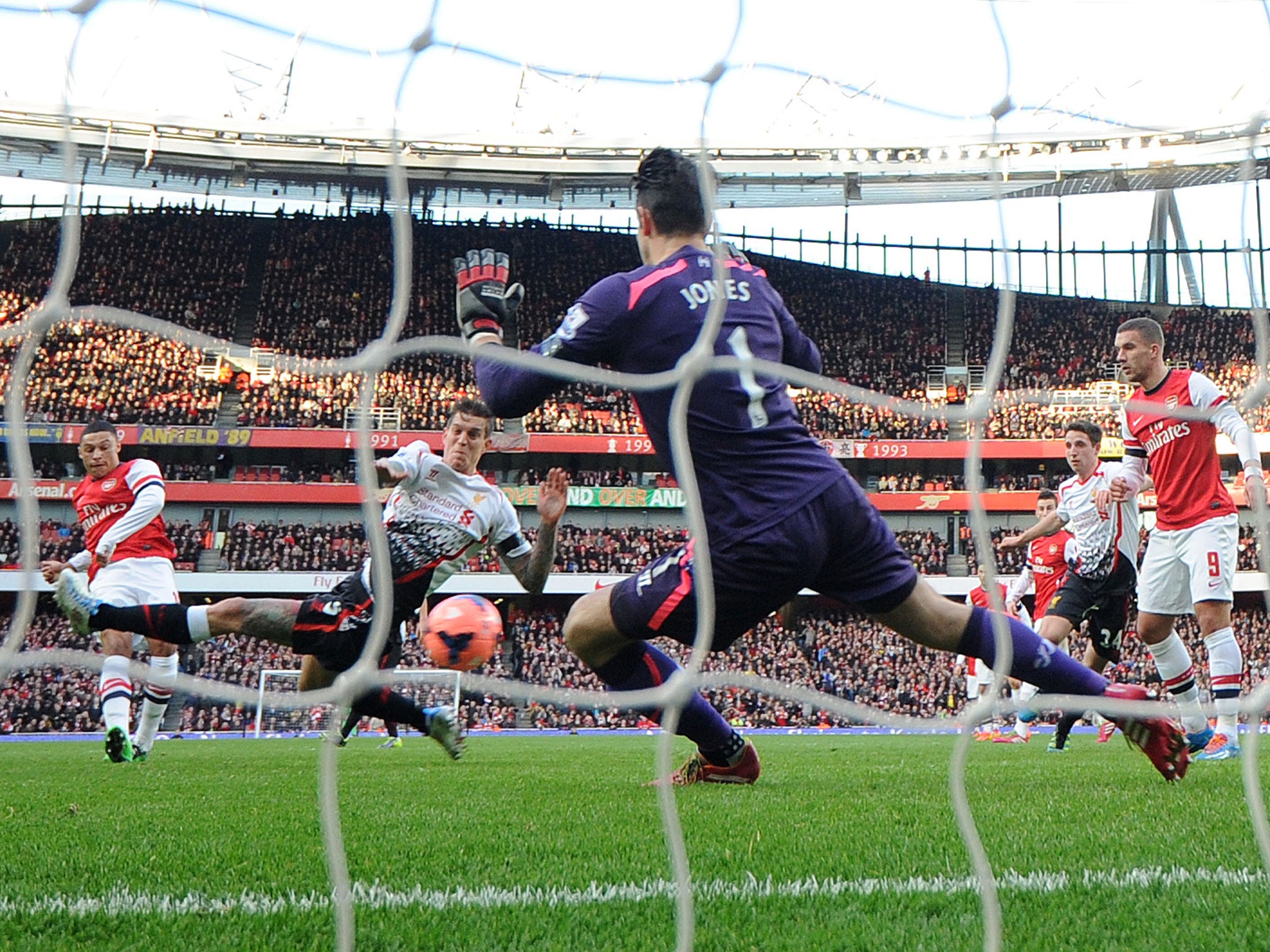 Alex Oxlade Chamberlain opens the scoring for Arsenal in their FA Cup tie against Liverpool