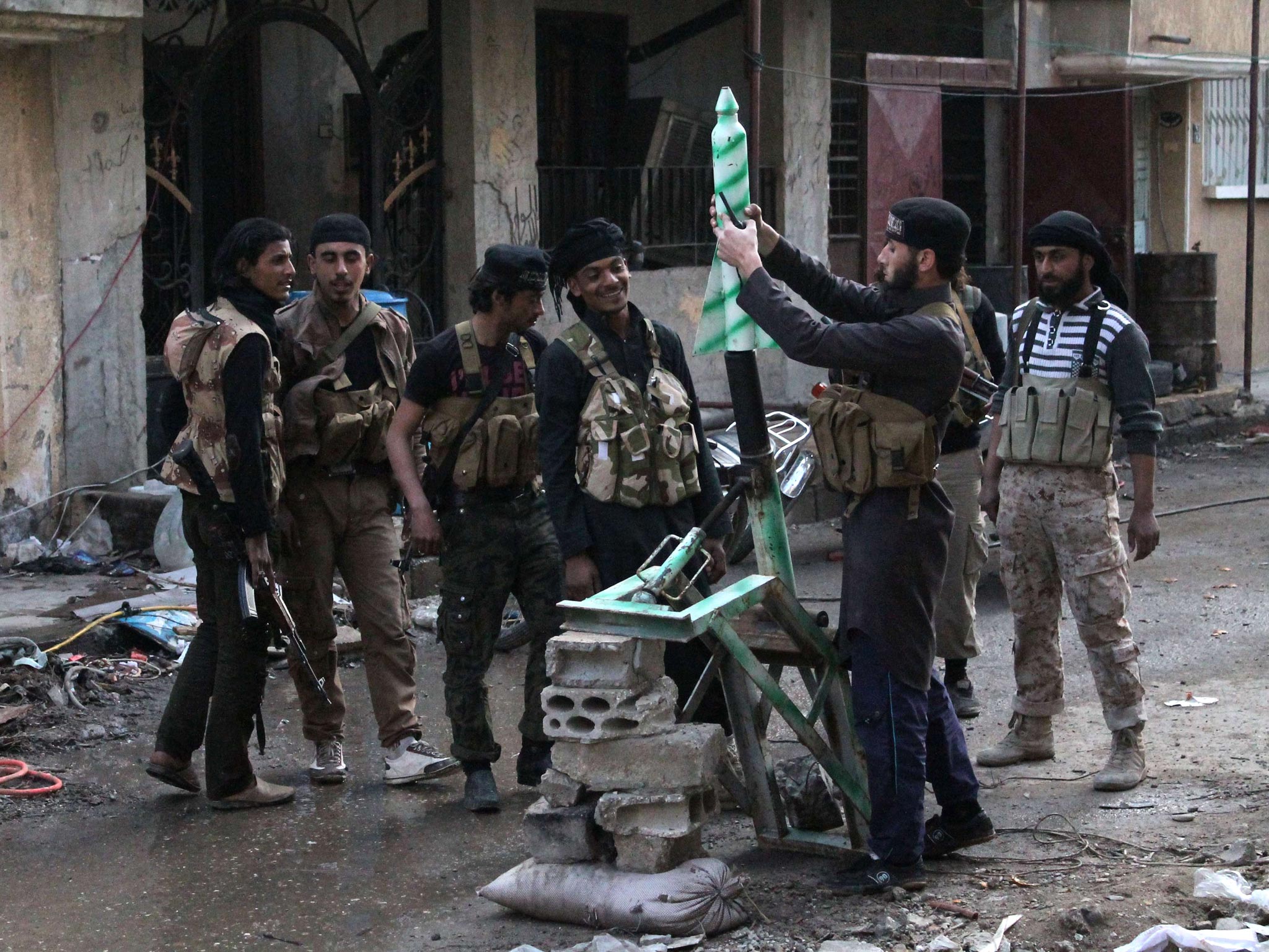 Rebel fighters in the eastern Syrian town of Deir Ezzor yesterday
