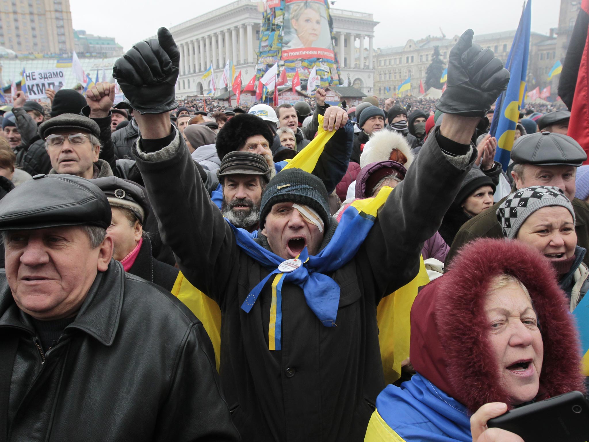 Opposition supporters shout slogans during a rally in Independence Square in Kiev, Ukraine
