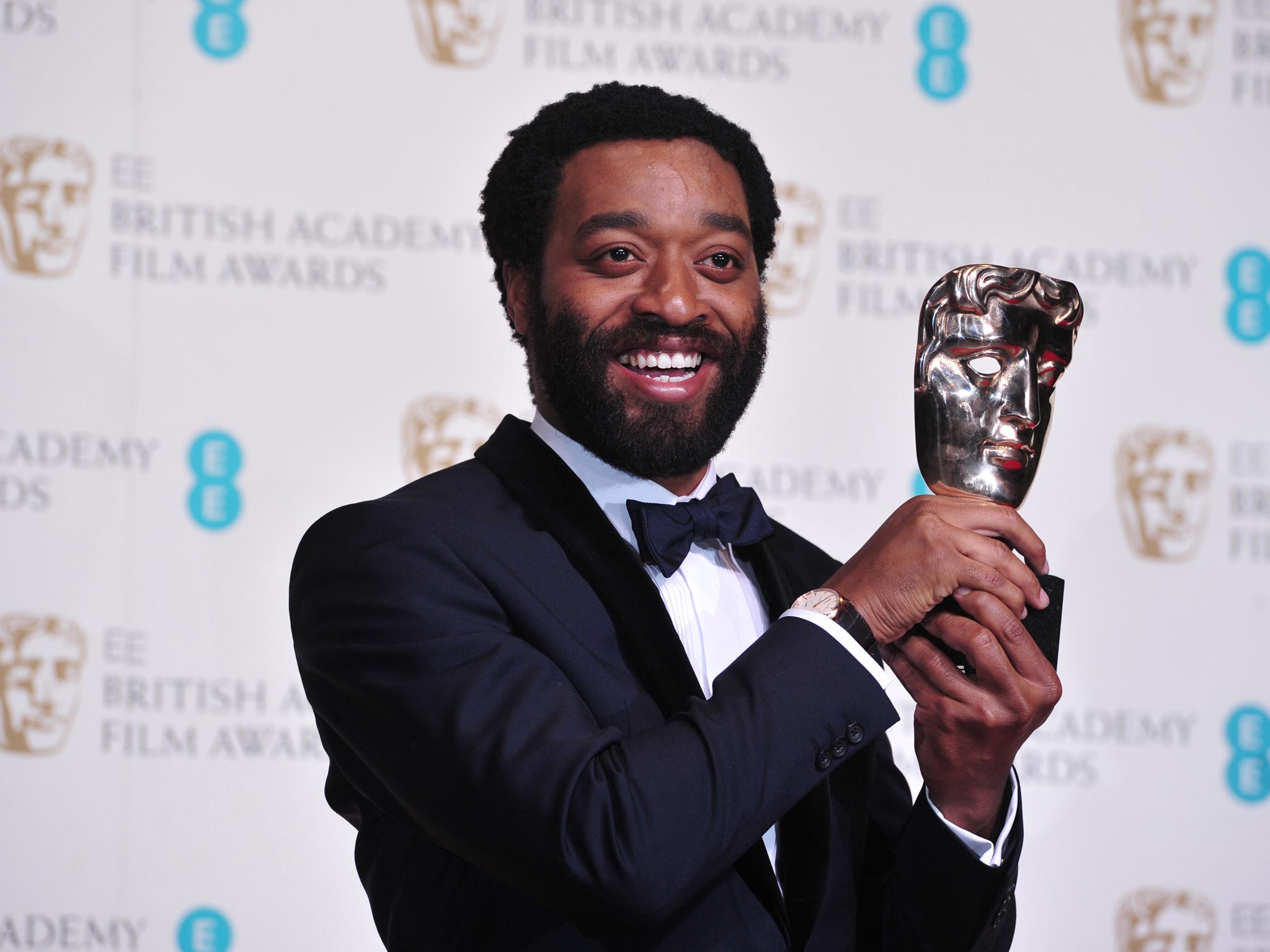 Chiwetel Ejiofor poses with the award for a leading actor for his work on the film '12 Years a Slave' 