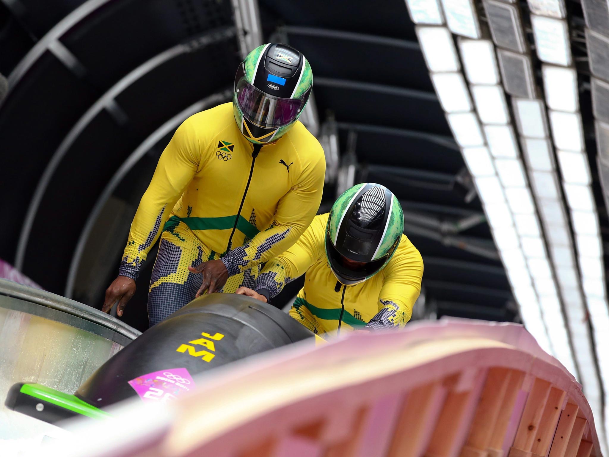 Winston Watts and Marvin Dixon of Jamaica after the second run of the Two-Man Bobsleigh competition at the Sanki Sliding Center
