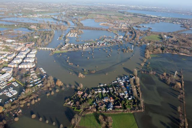 Flood water in Chertsey, Surrey, as Royal Engineers were now being tasked to carry out a high-speed assessment of damage to the UK's flood defence infrastructure