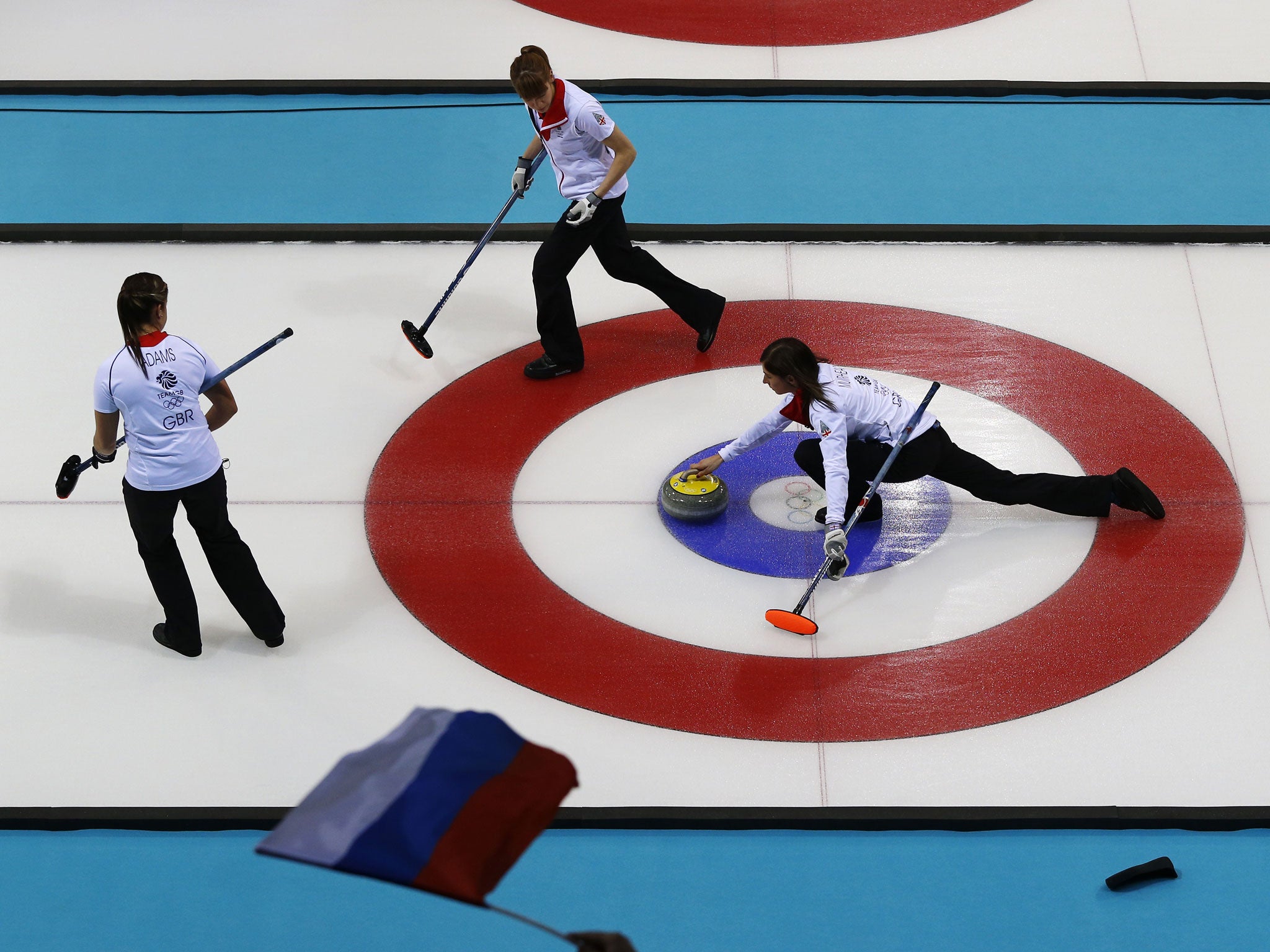 Great Britain skipper Eve Muirfield throws a stone across the ice during the 9-6 victory over Russia