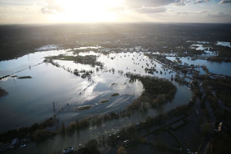 Flood water spills from the river Thames on Sunday in Chertsey, England.
