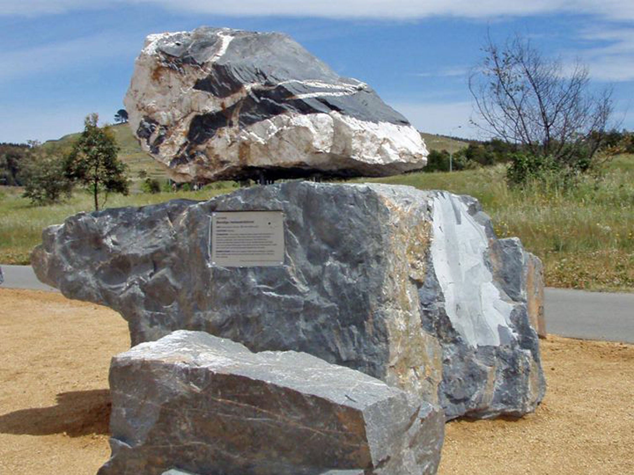 Despite its impressive appearance, the two-tonne rock from the Bendigo Goldfield in Victoria (top) actually contains an almost negligible quantity of precious materials