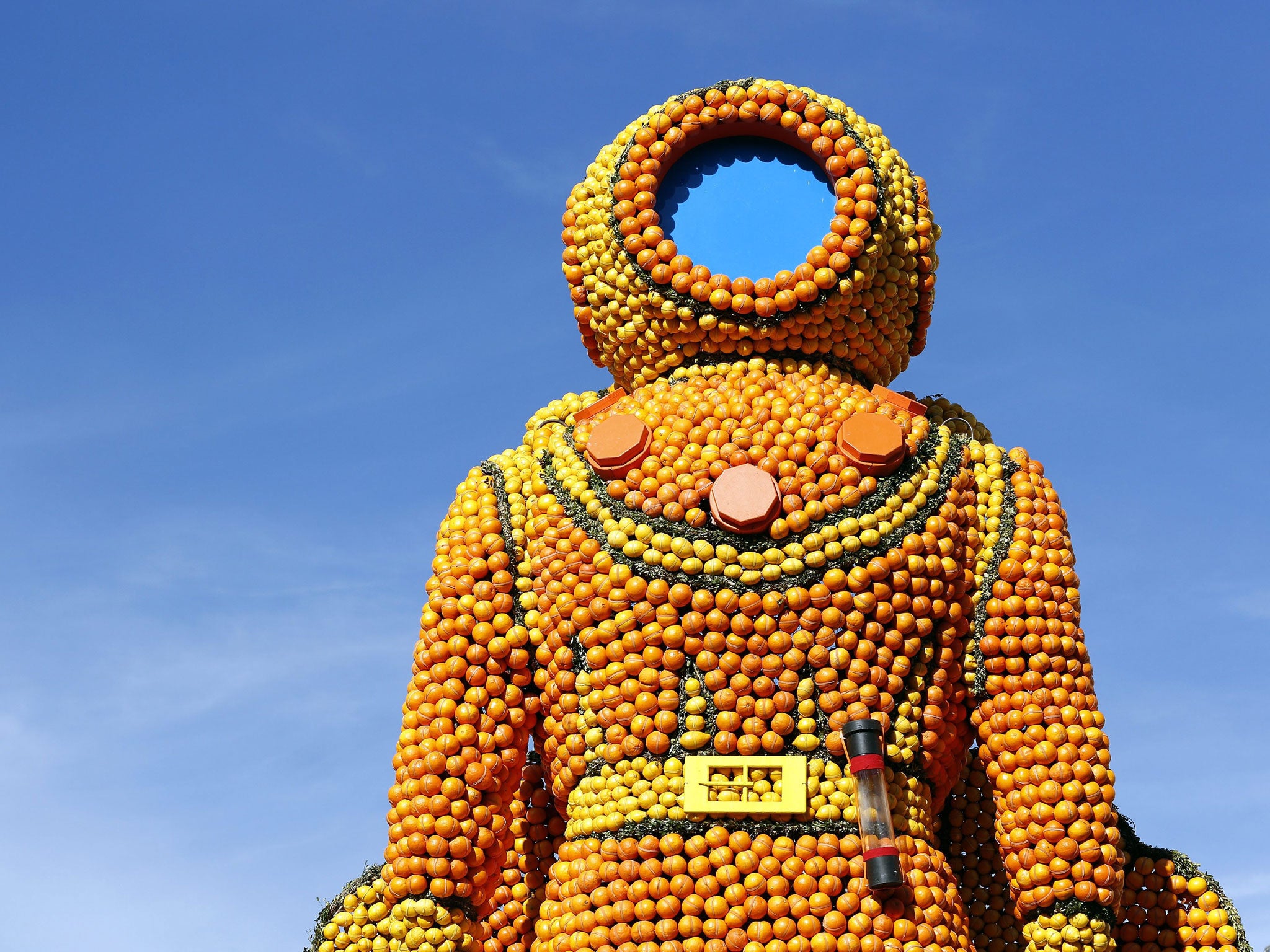 A view at the sculpture 'Le Scaphandrier' made with lemons and oranges ahead of the 81st Lemon Festival in Menton