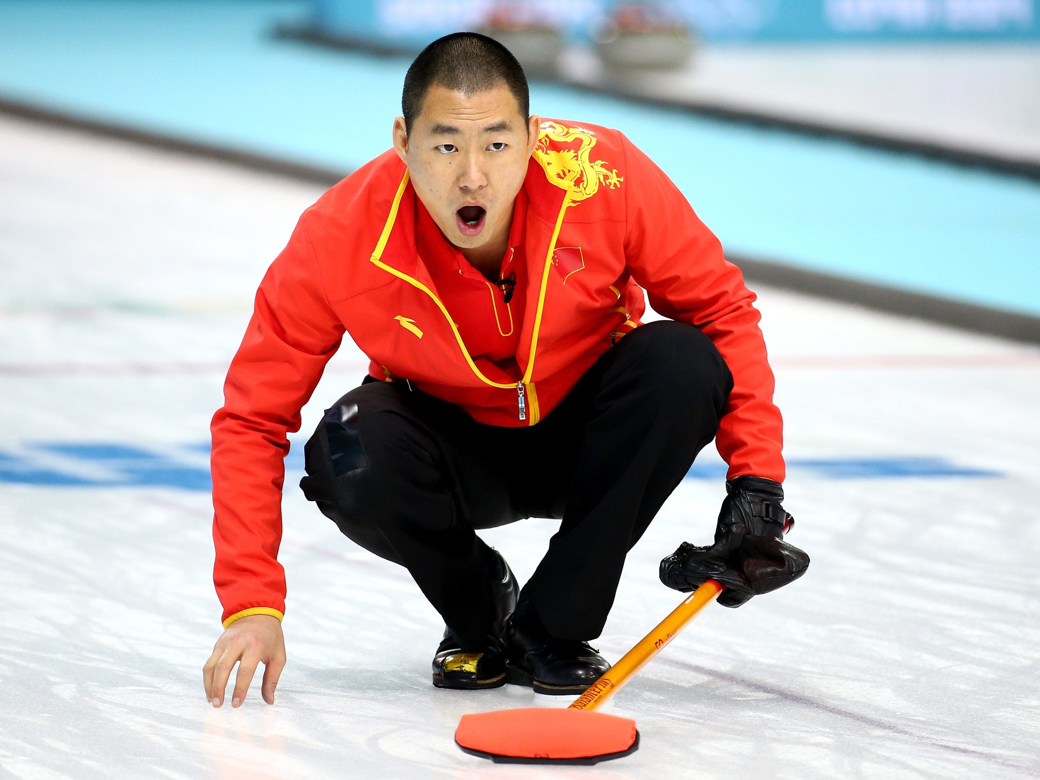 Rui Liu of China competes against Great Britian during the Men's Curling Round Robin on day ten of the Sochi 2014 Winter Olympics
