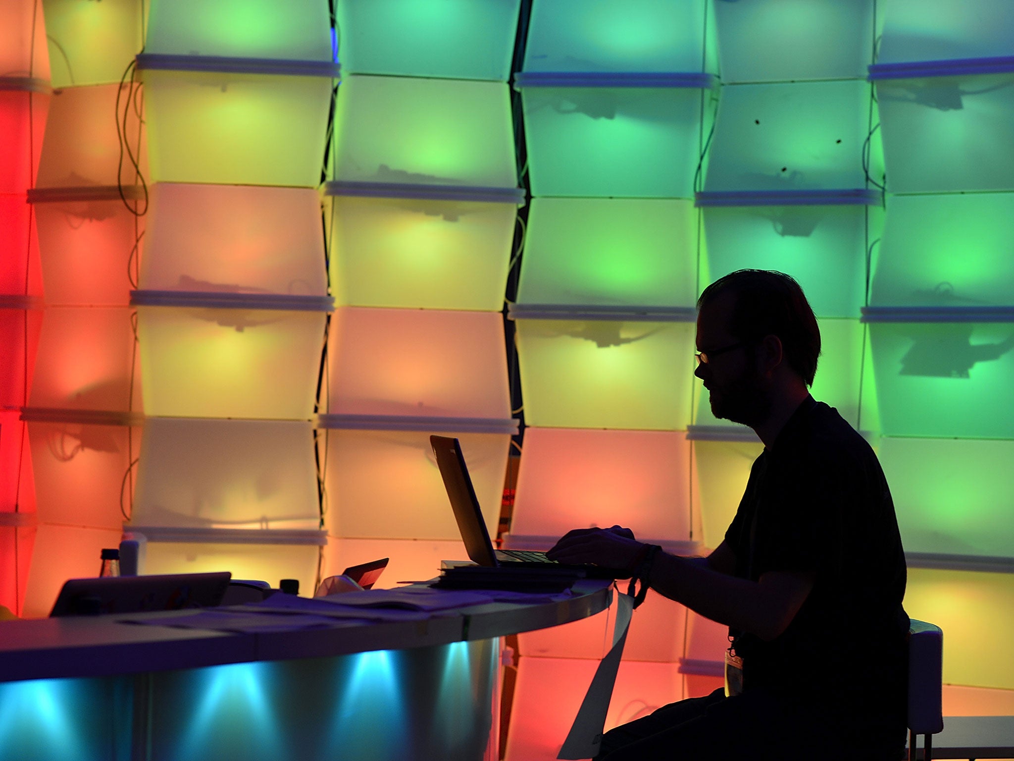 A man (unrelated to the research) uses a laptop computer.